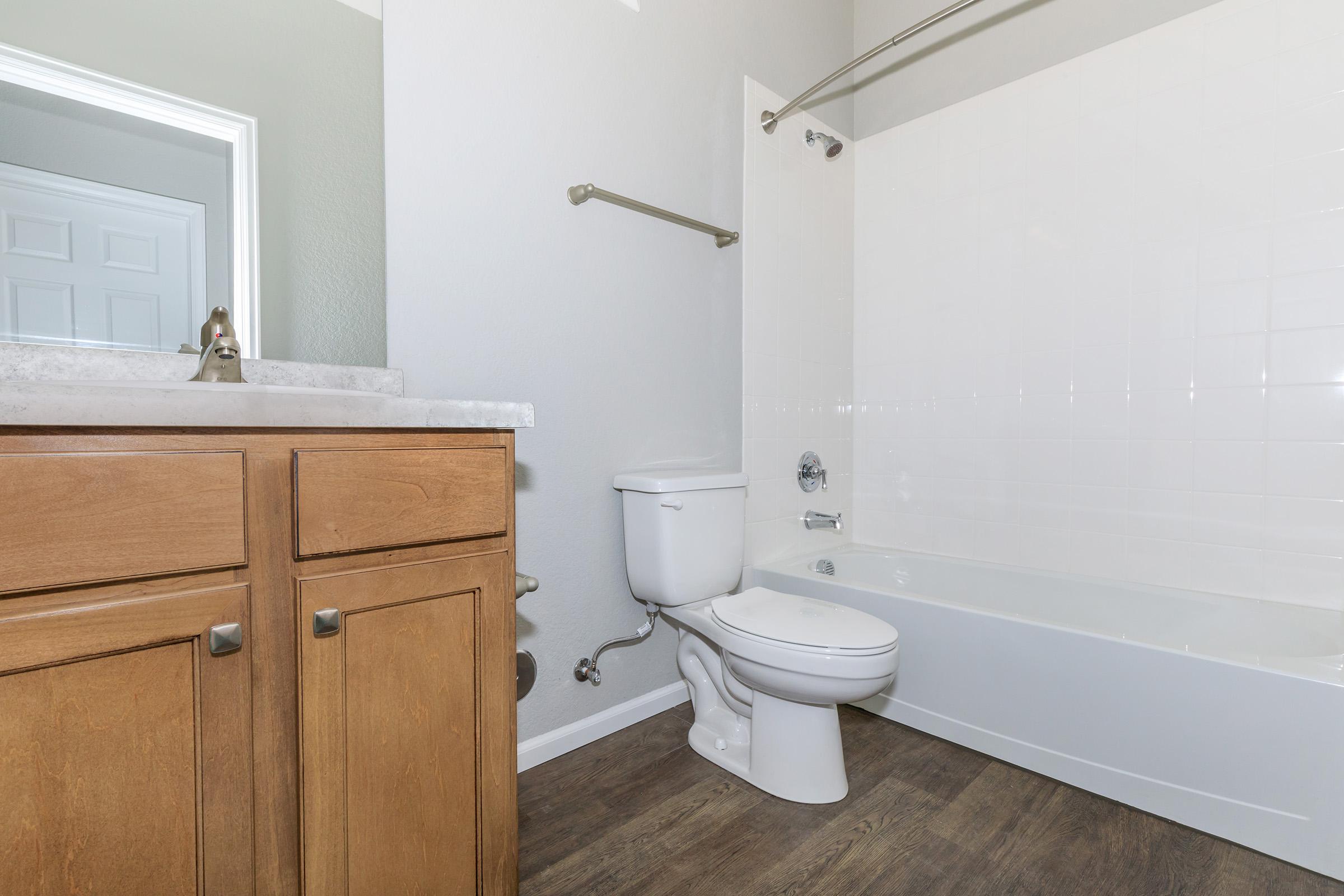 a large white tub sitting next to a sink