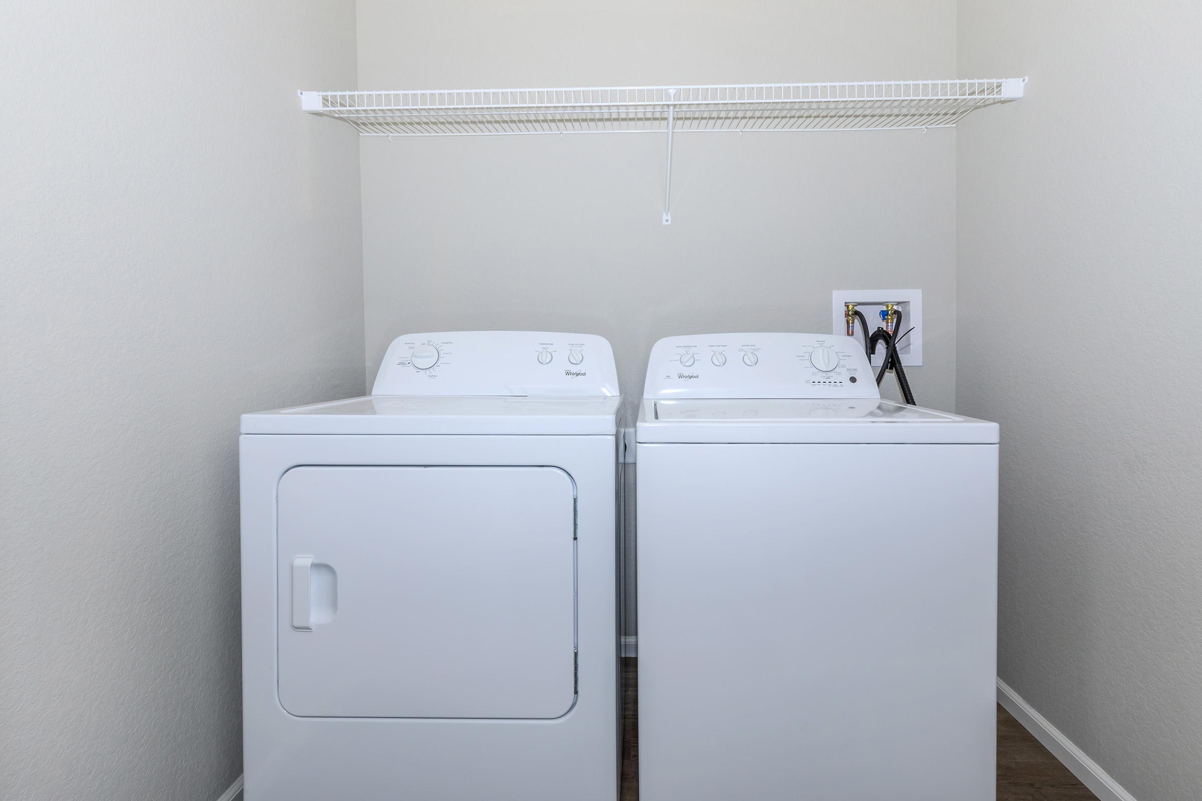 a white refrigerator freezer sitting in a room