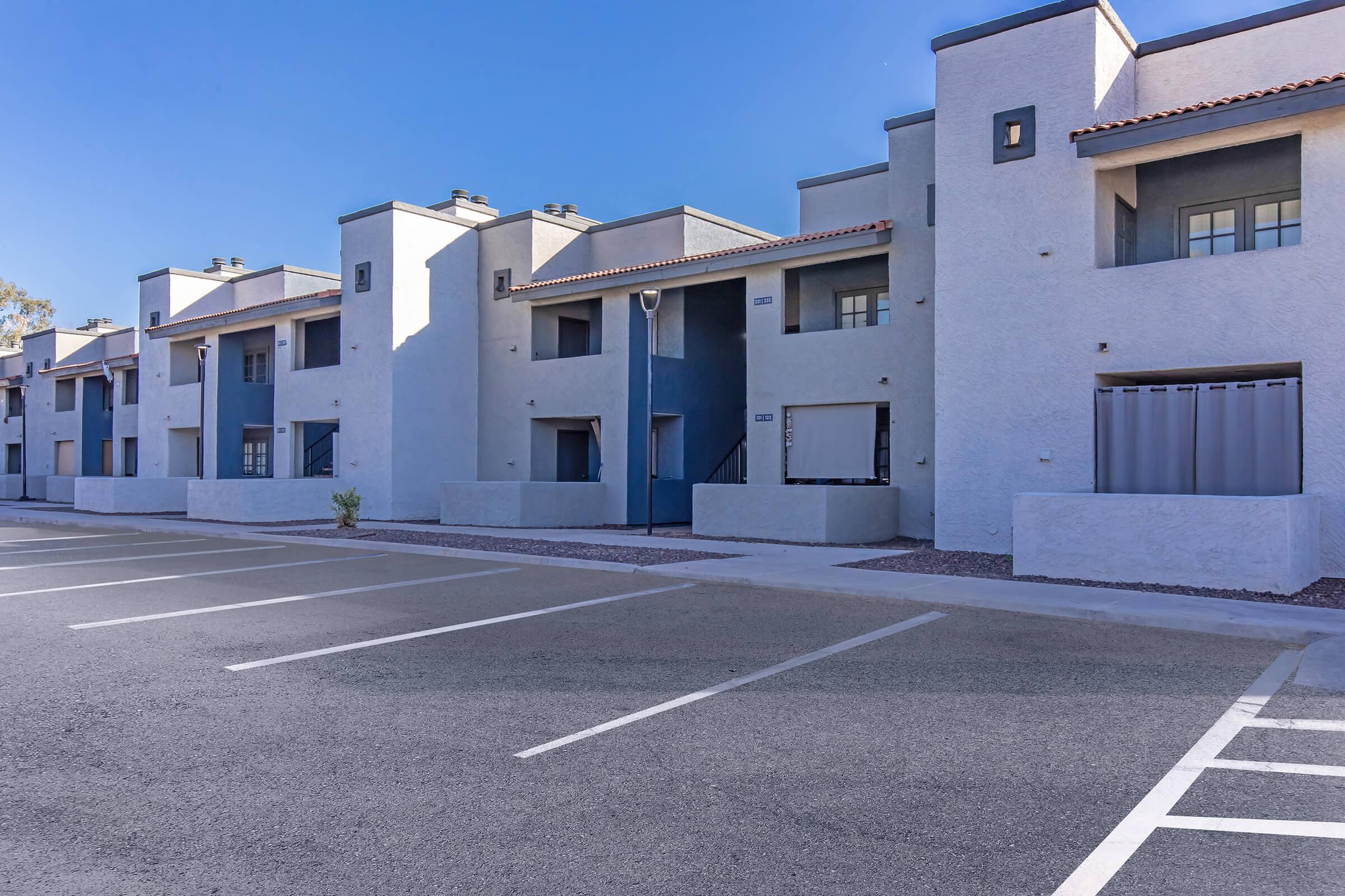 an empty road in front of a building