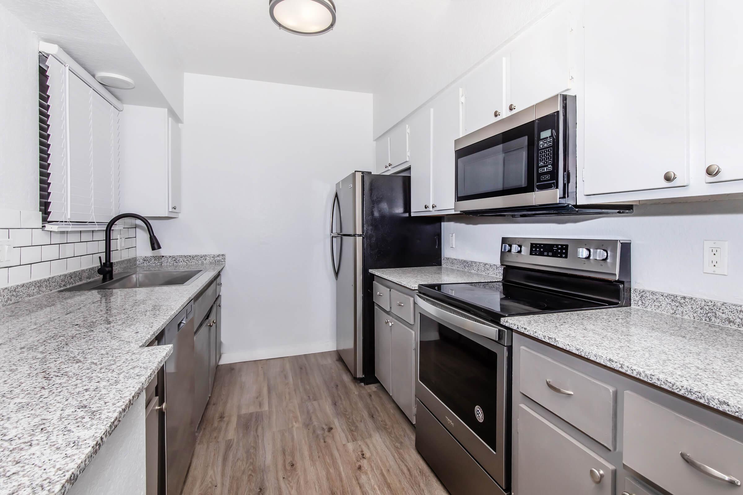 a modern kitchen with stainless steel appliances