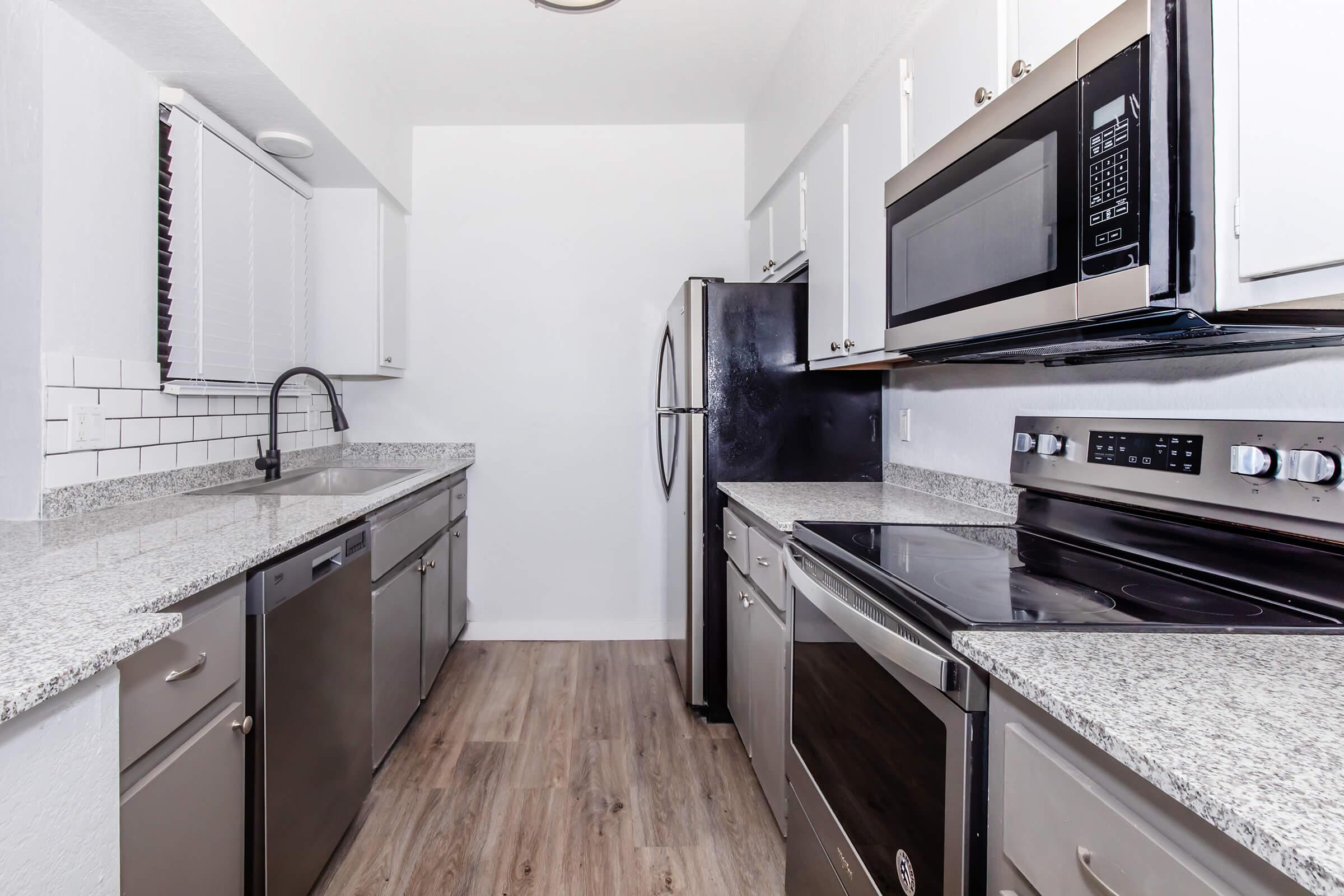 a modern kitchen with stainless steel appliances