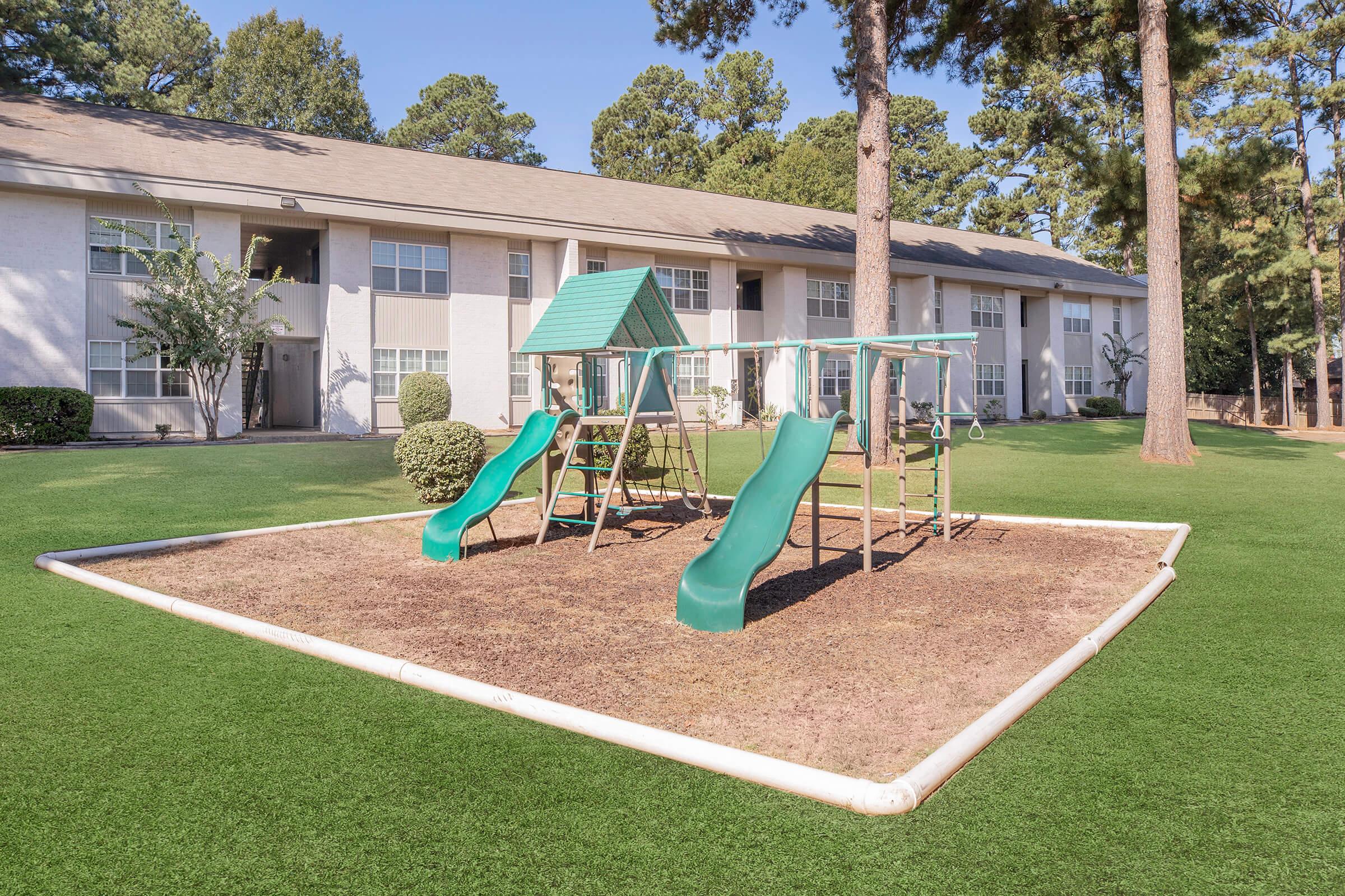 a green lawn in front of a house