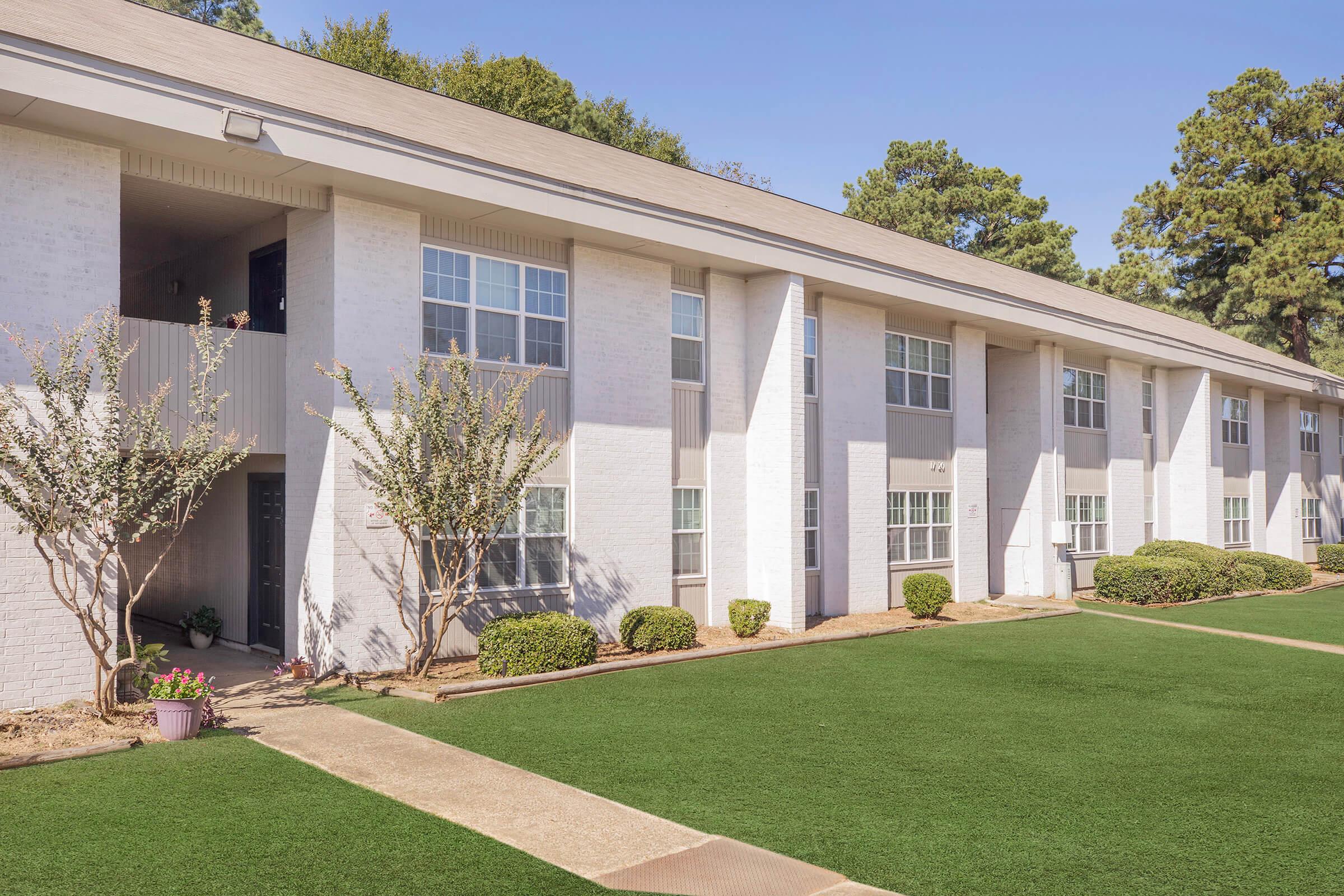 a large lawn in front of a building