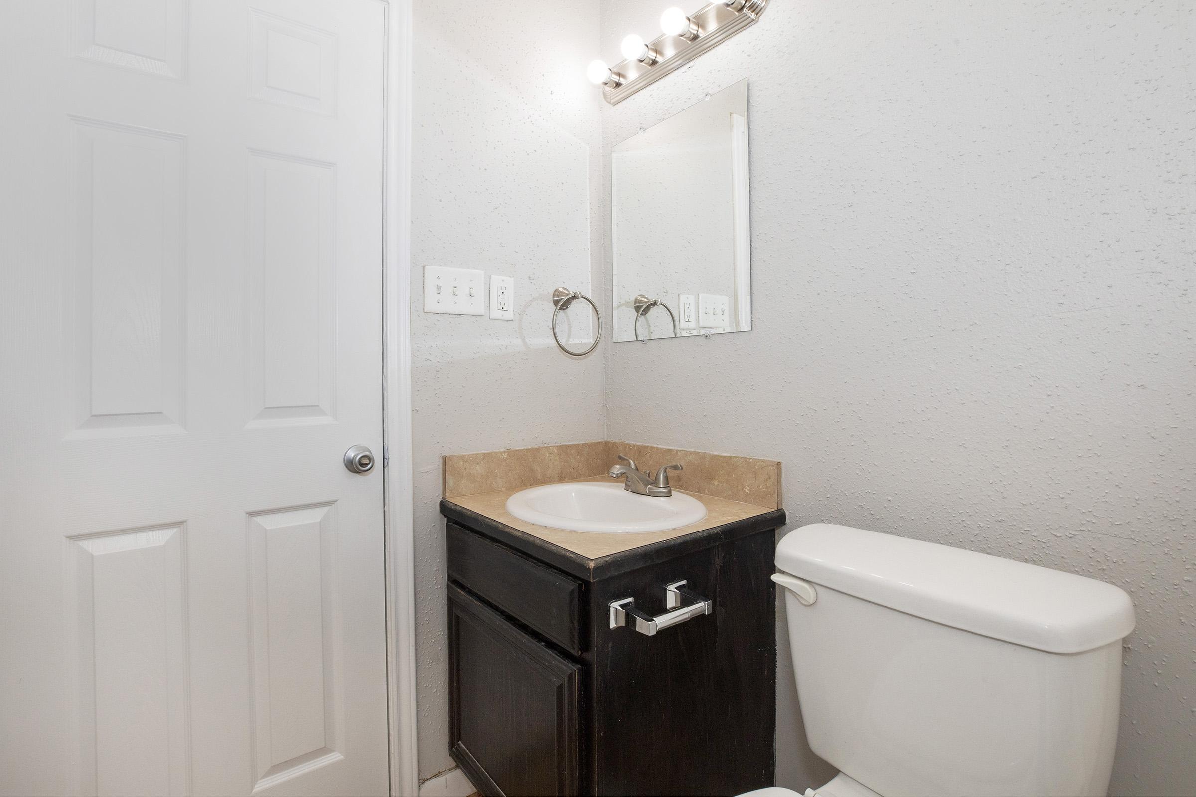 a close up of a sink in a small room