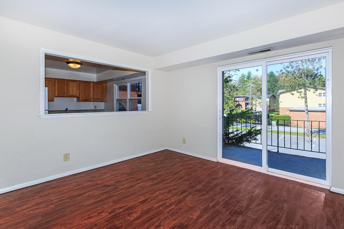 a room filled with furniture and a large window