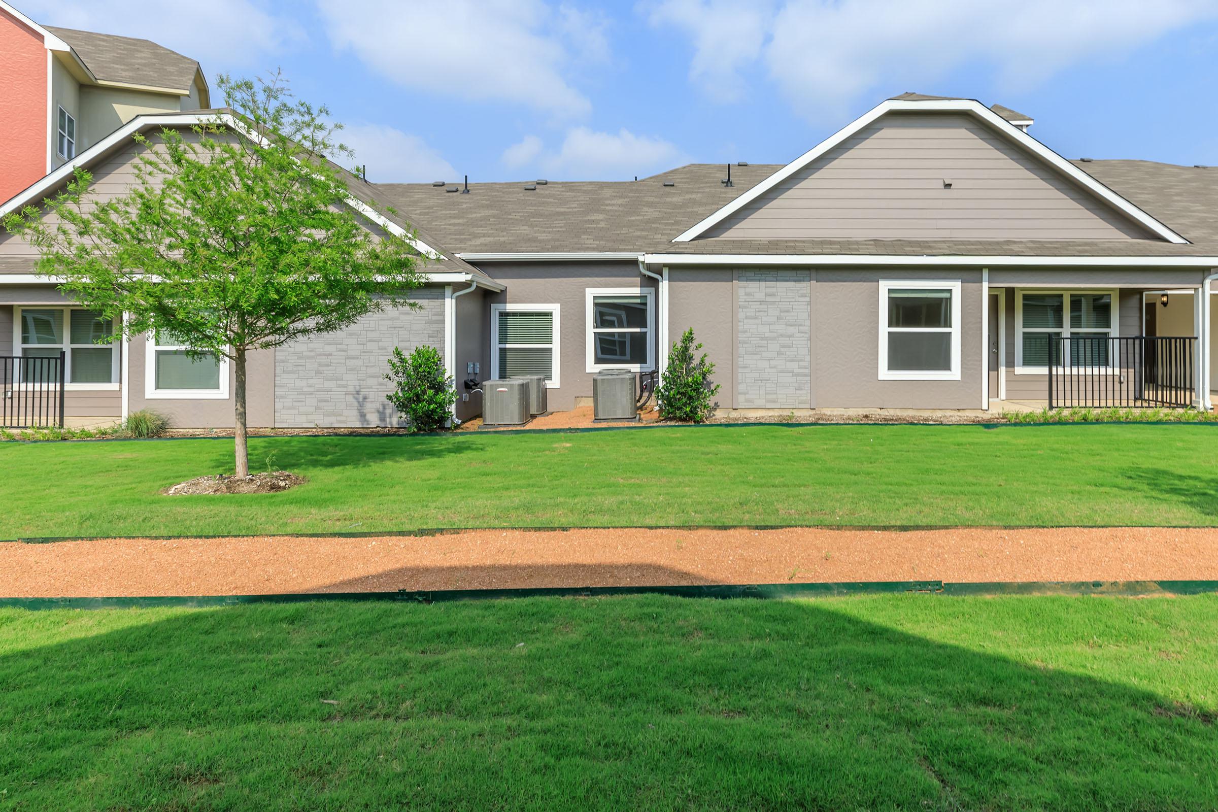 a large lawn in front of a house