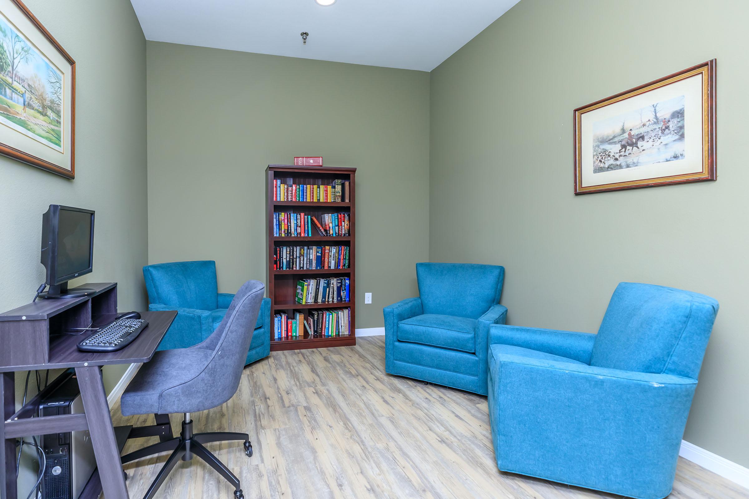 a living room with a blue chair