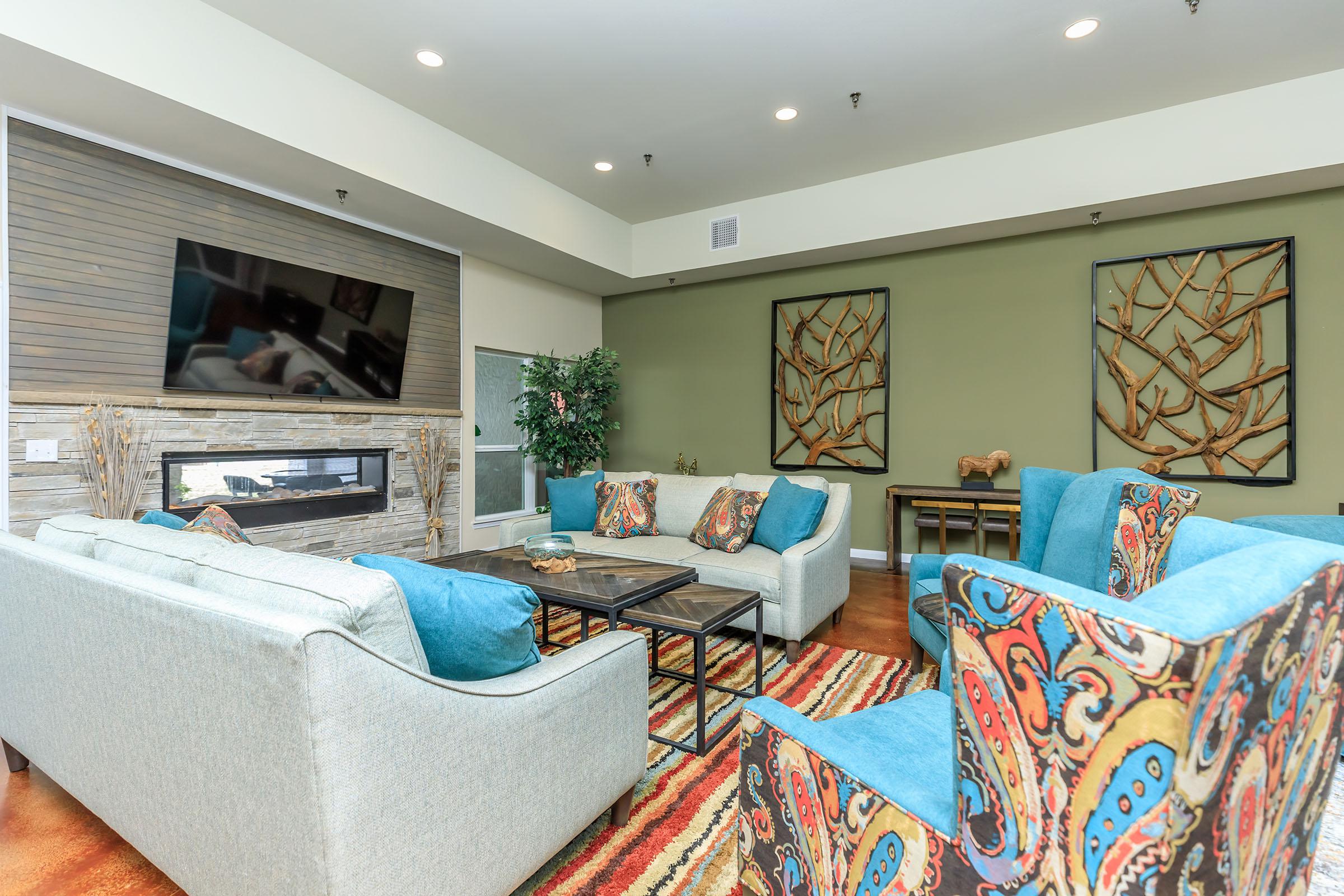 a living room filled with furniture and a large window