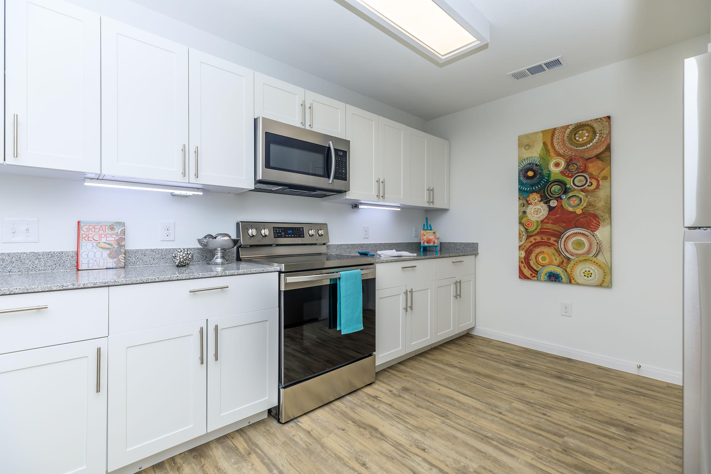 a kitchen with a stove and a refrigerator