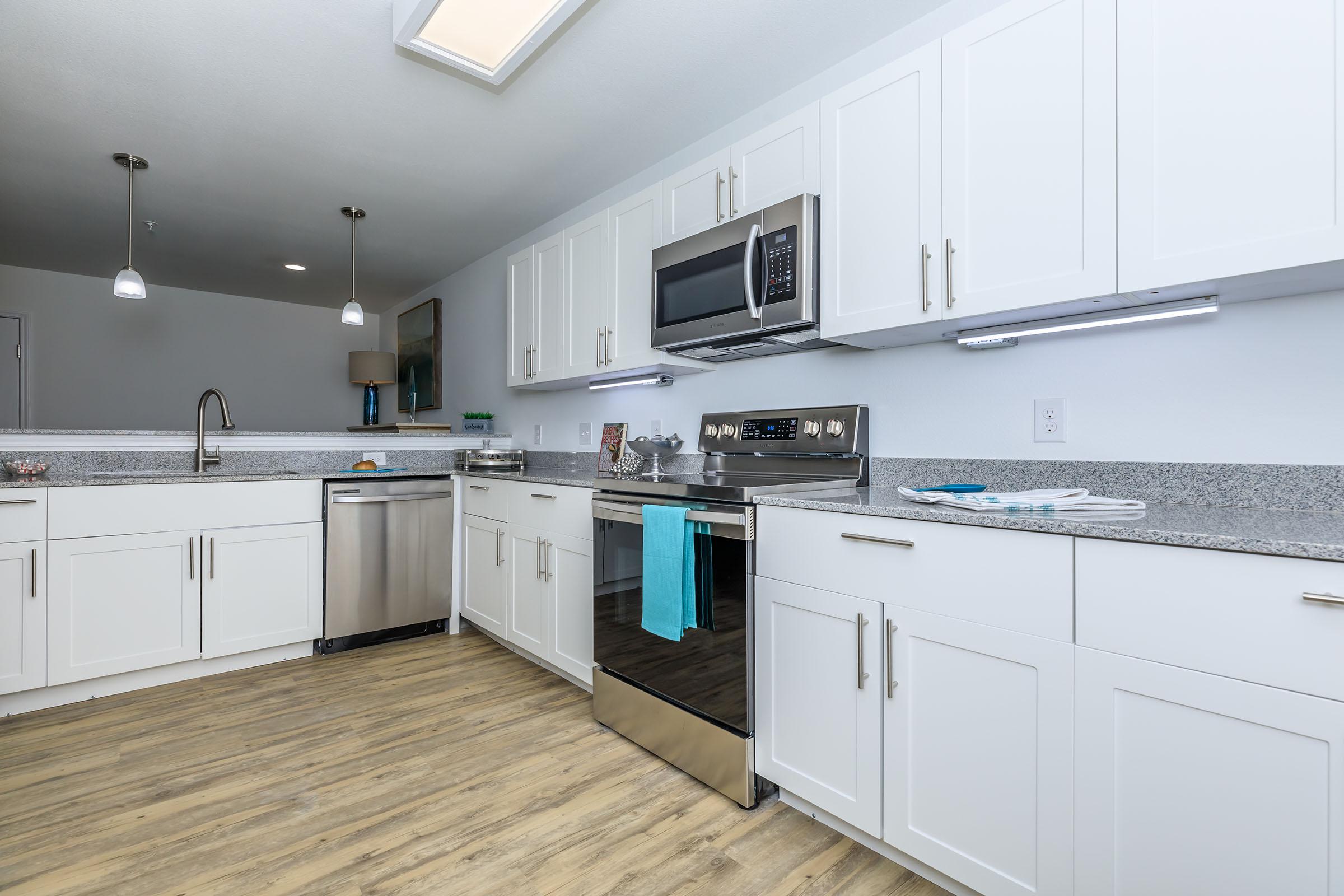 a large kitchen with stainless steel appliances