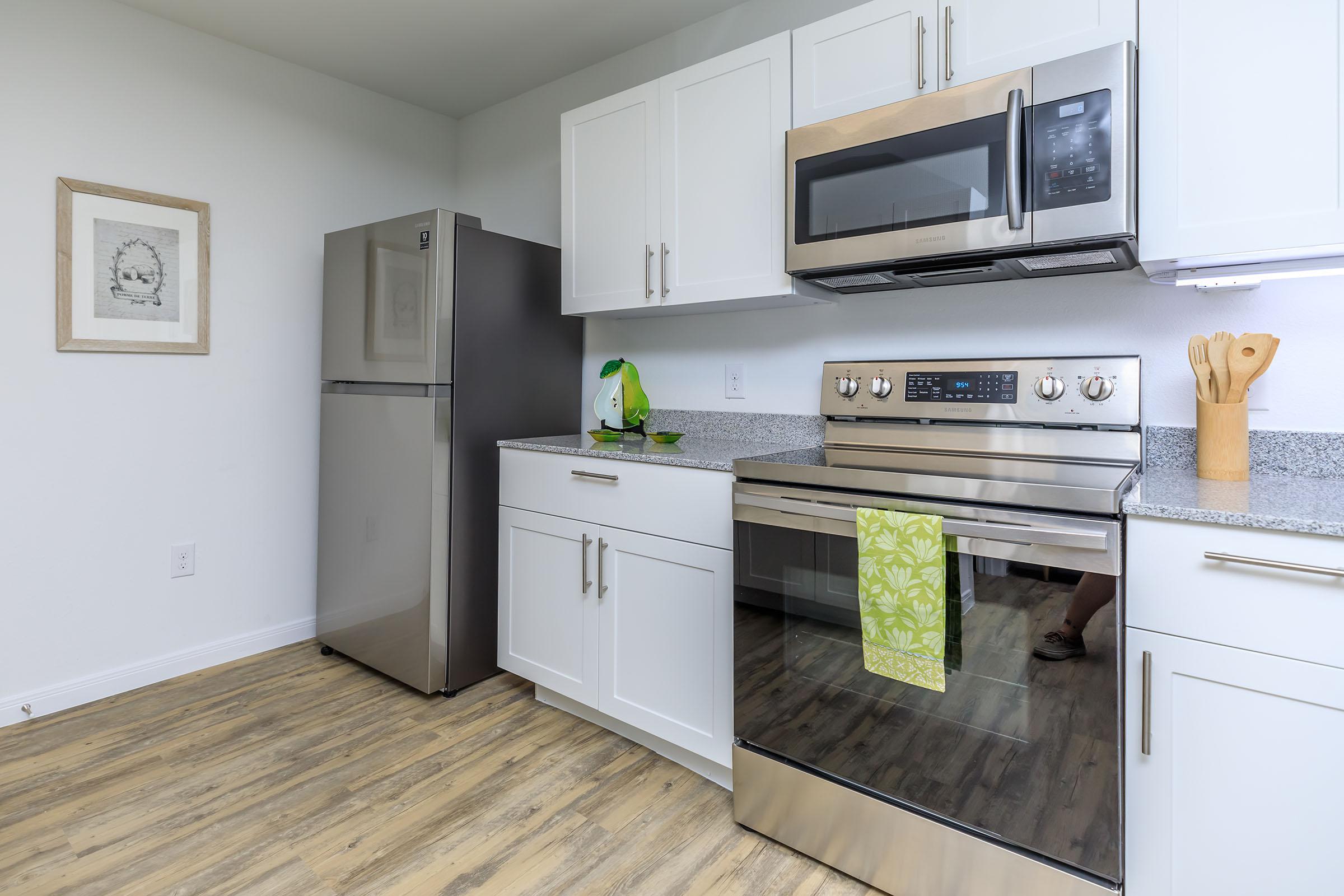 a kitchen with a stove top oven sitting inside of a refrigerator