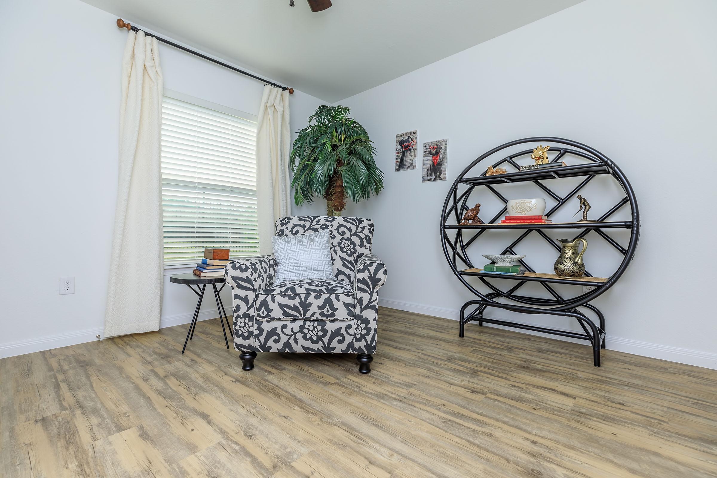 a bedroom with a bed and desk in a room