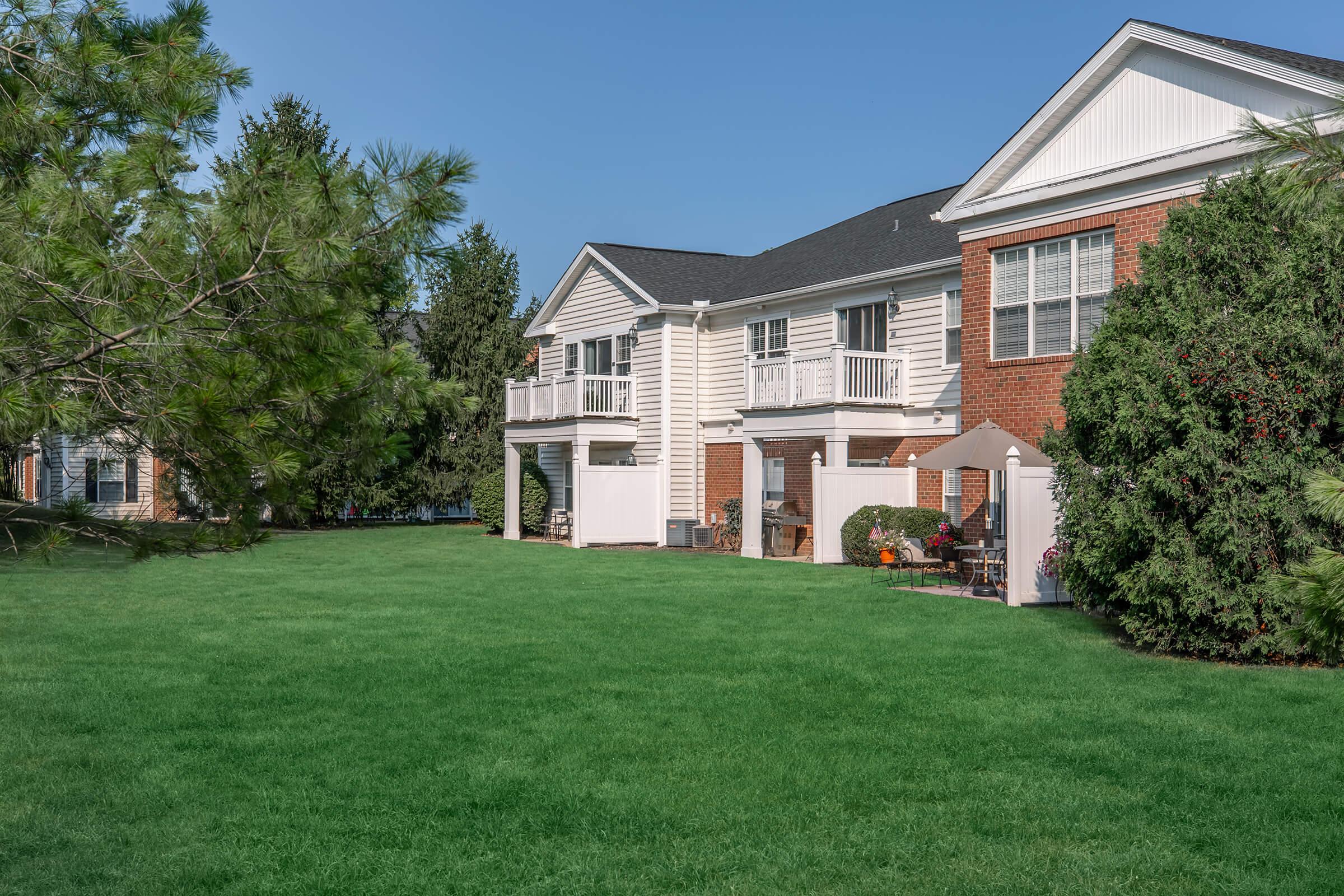 a large lawn in front of a house