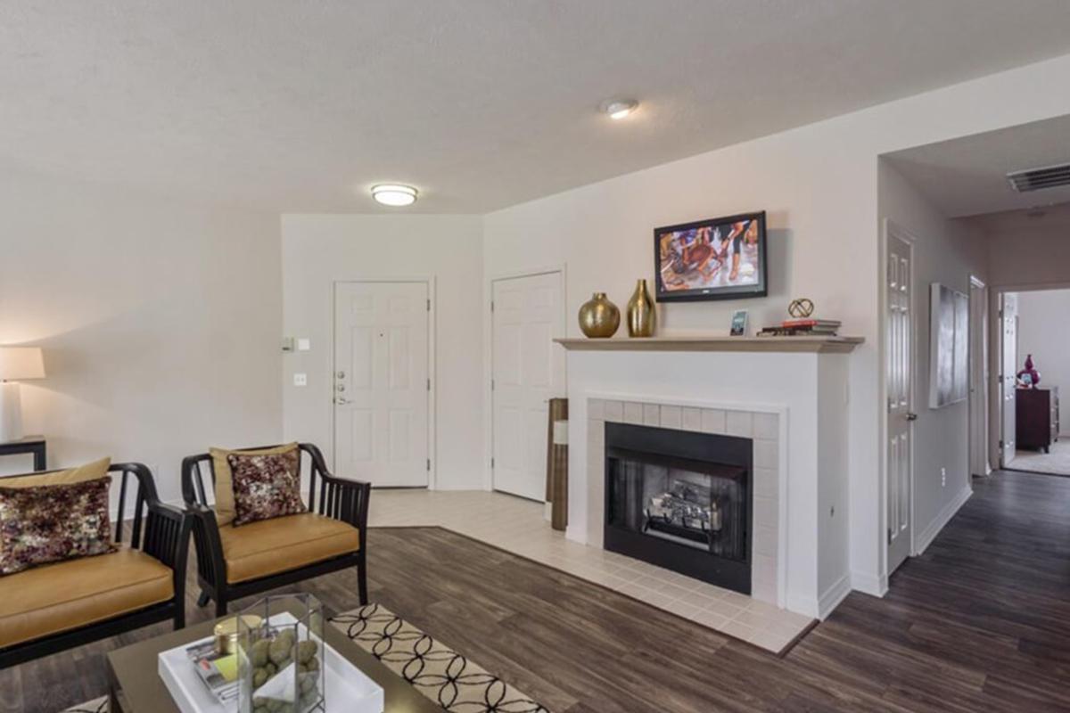 a living room filled with furniture and a fireplace