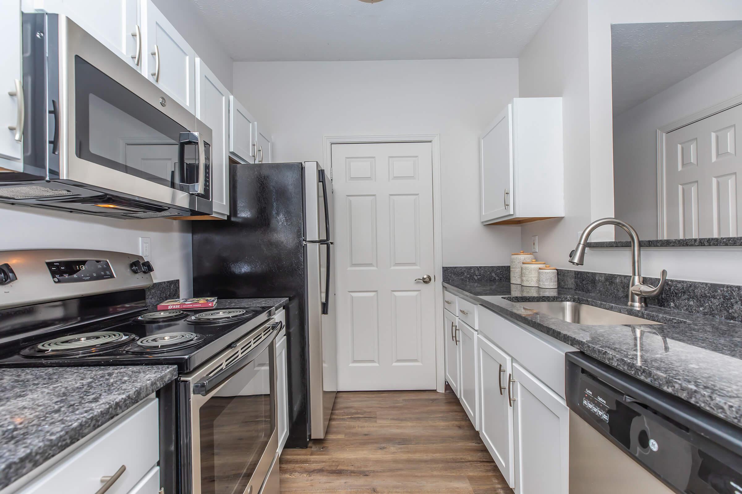 a modern kitchen with stainless steel appliances