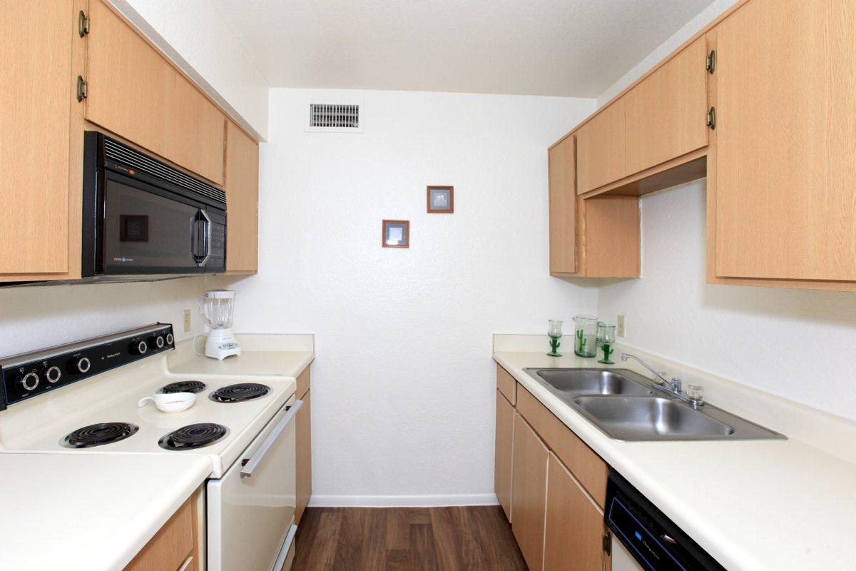 a kitchen with a white stove top oven