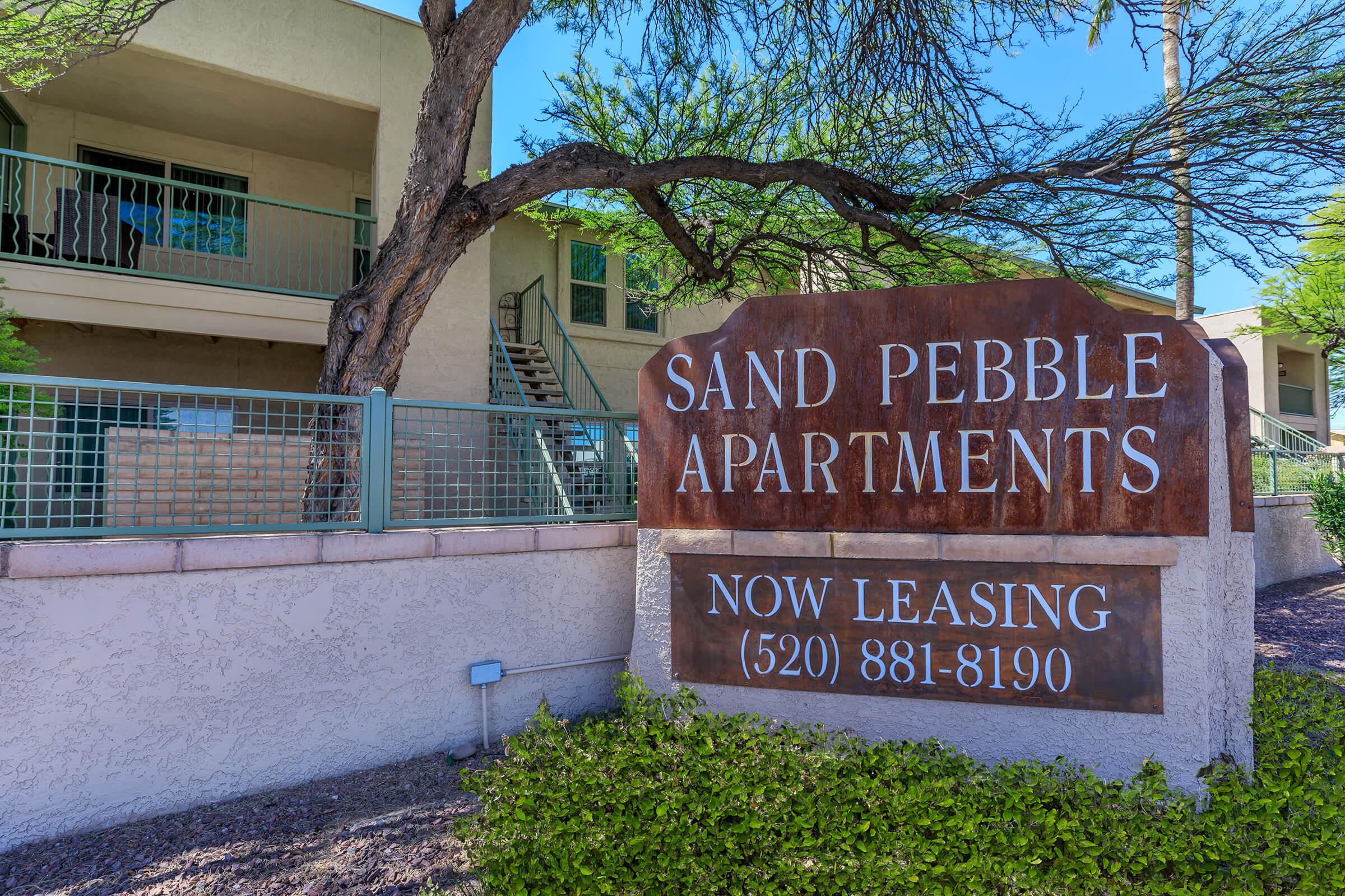 a sign in front of a building