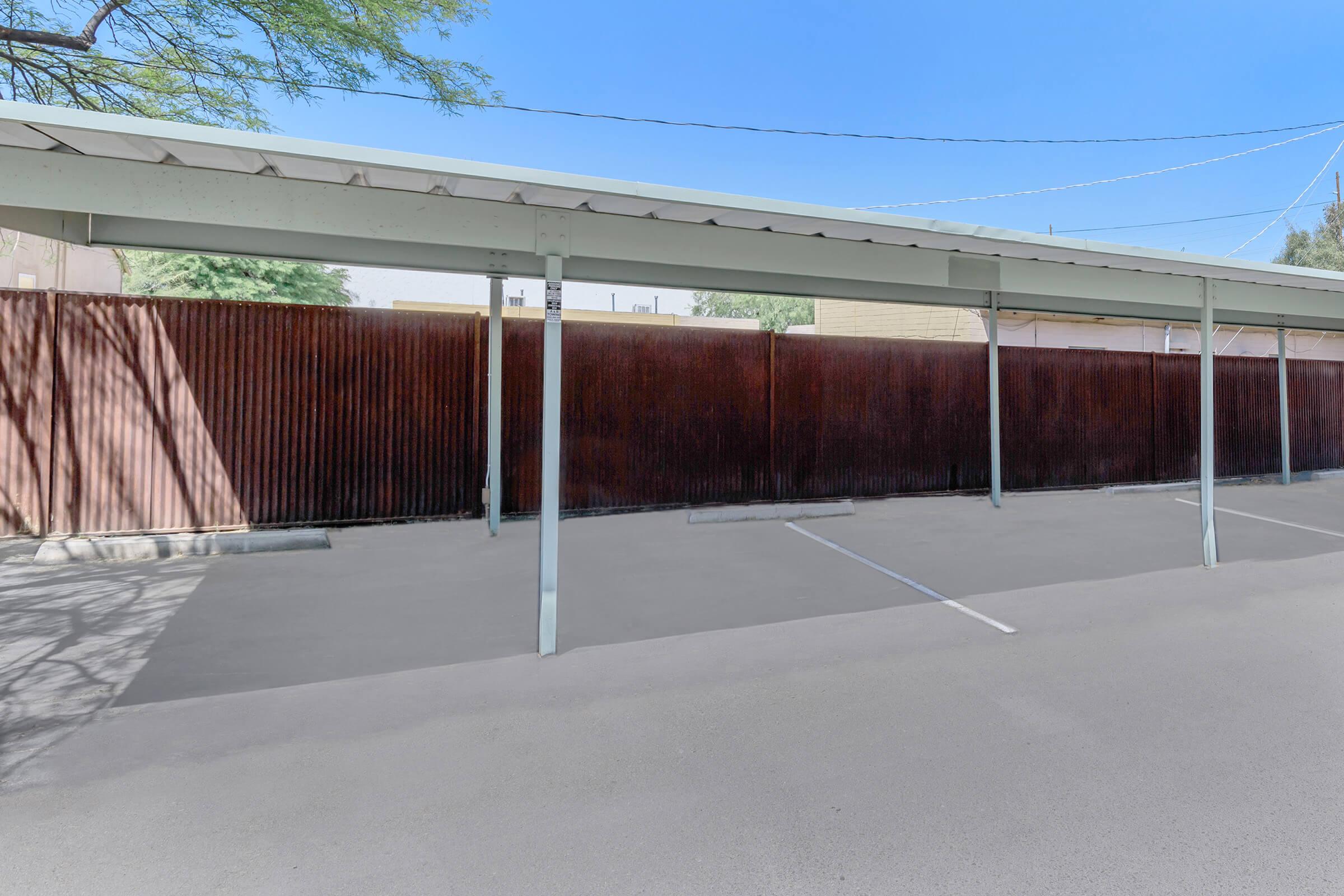 an empty parking lot in front of a building