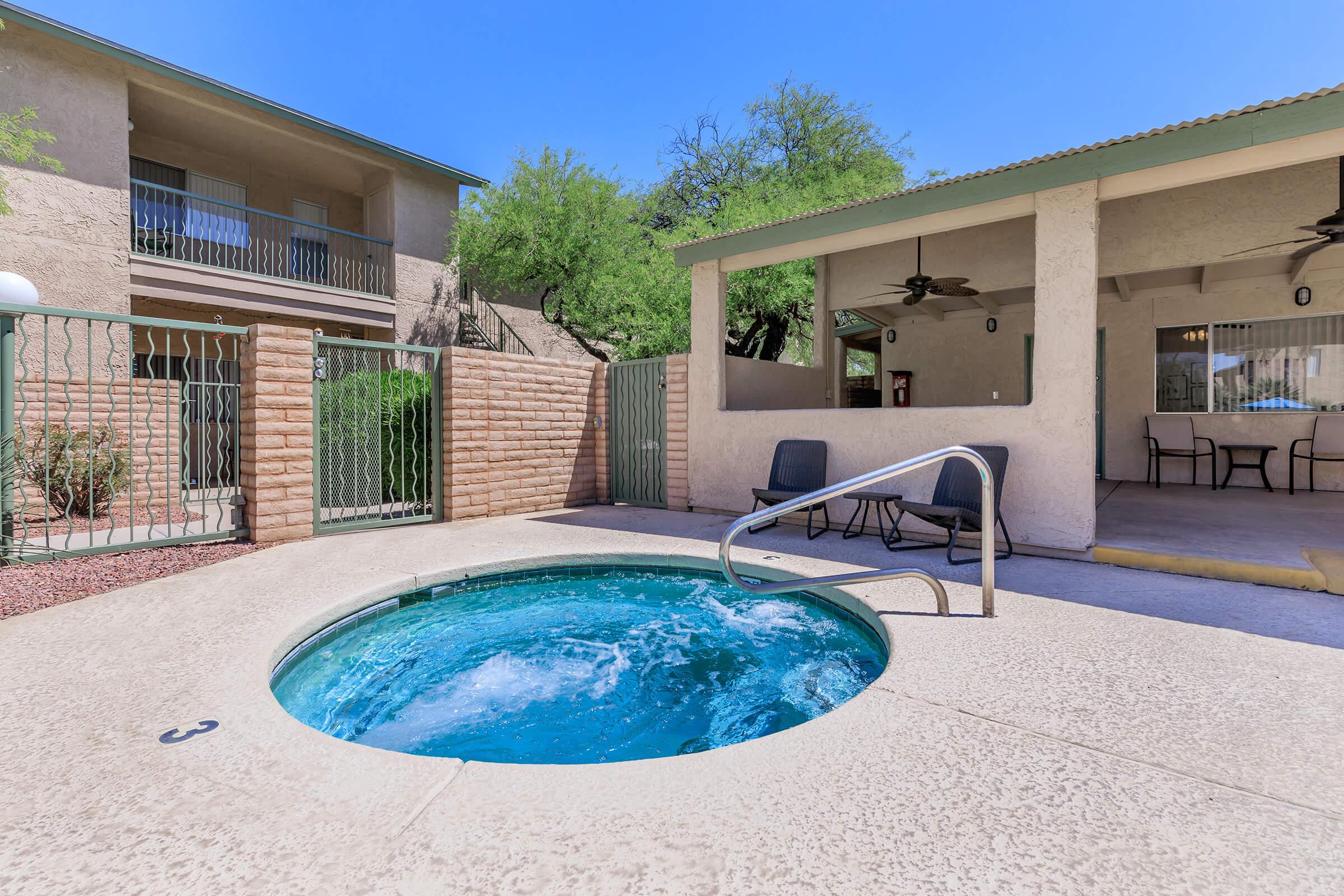 a house with a pool in front of a building