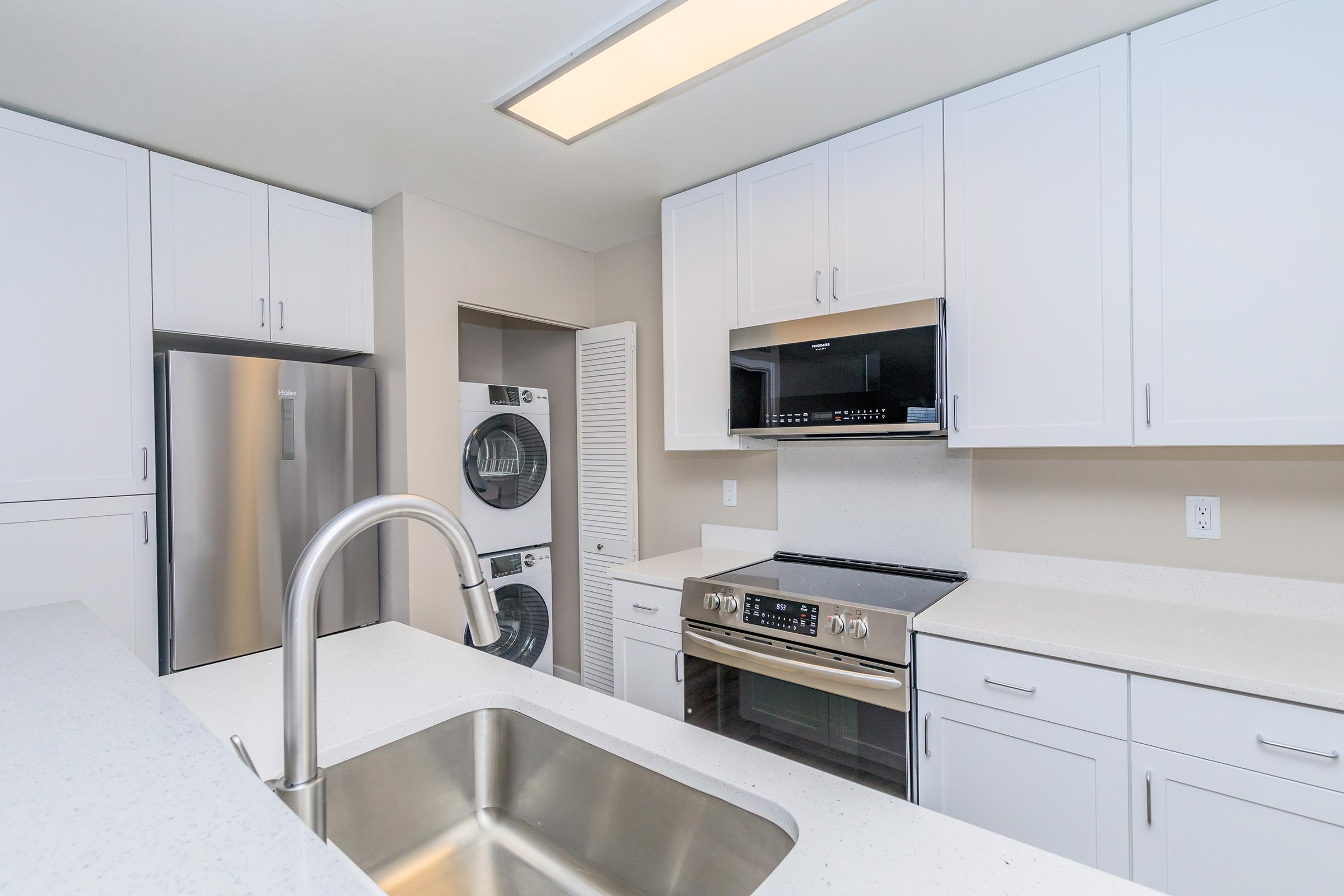 a modern kitchen with stainless steel appliances