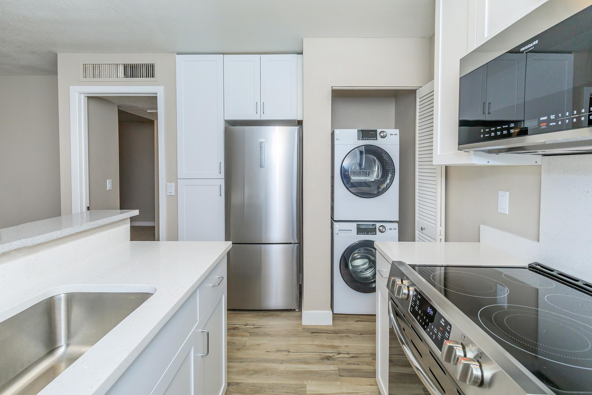 a kitchen with a sink and a microwave