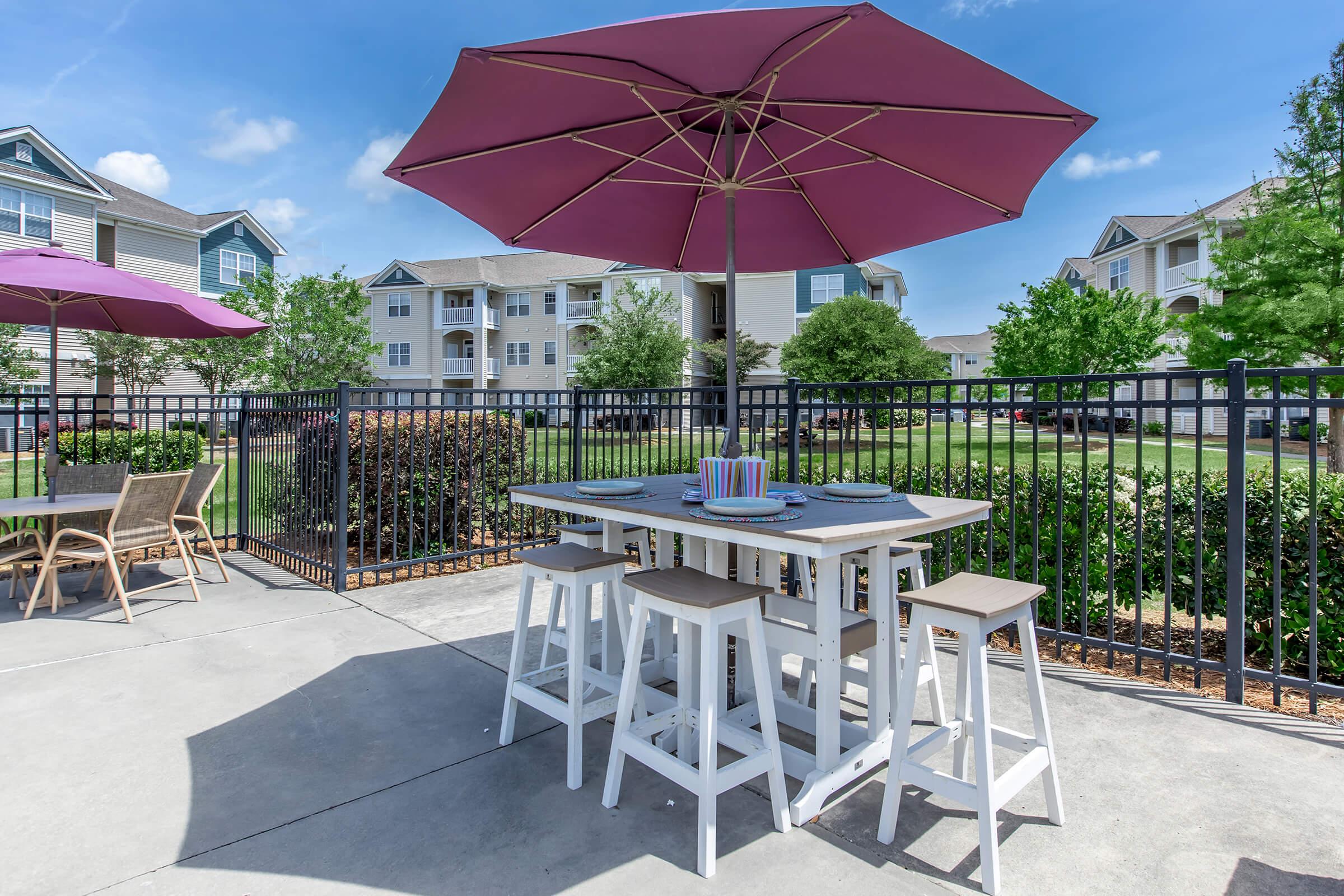 a lawn chair under an umbrella