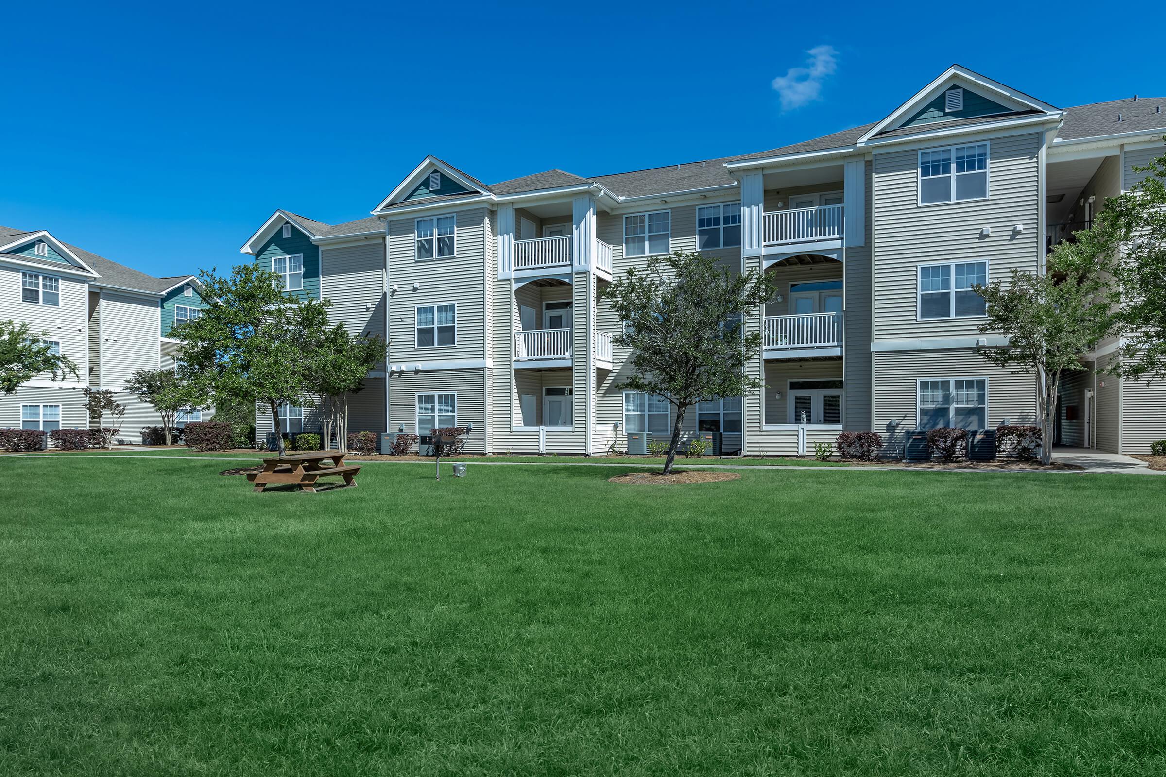 a large lawn in front of a house