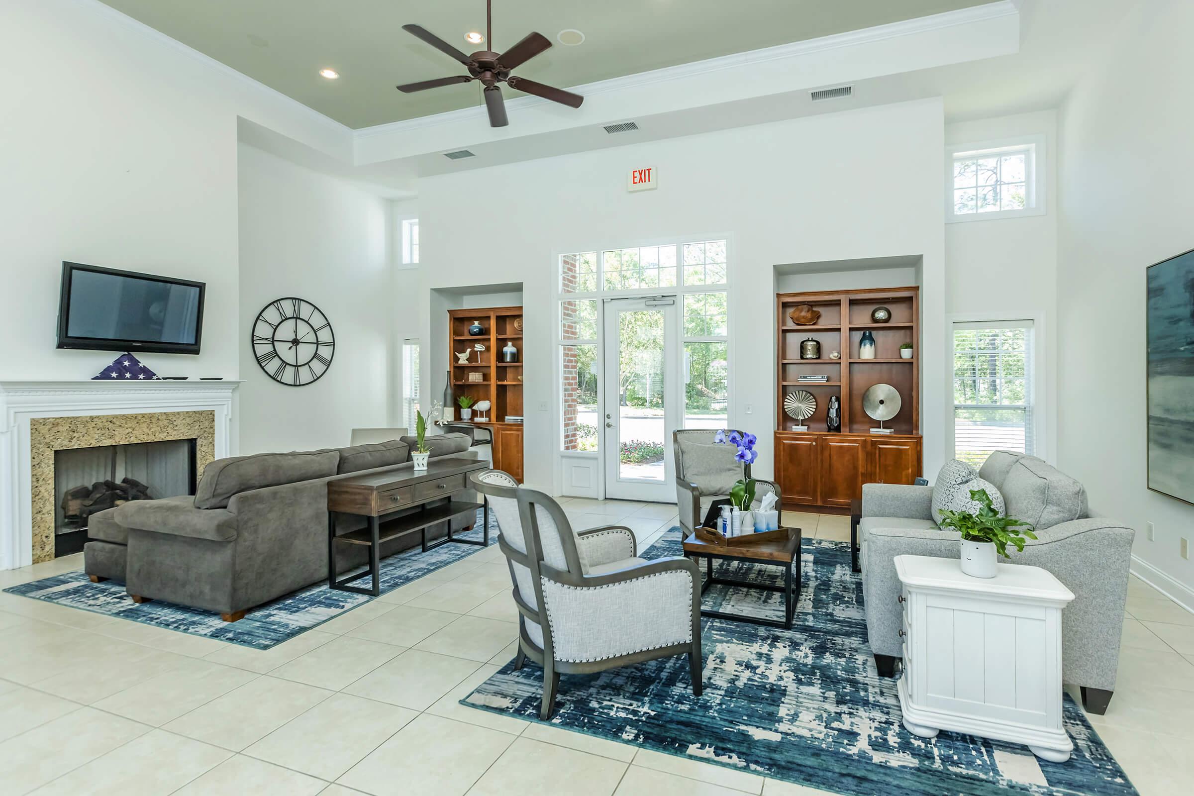 a living room filled with furniture and a fireplace