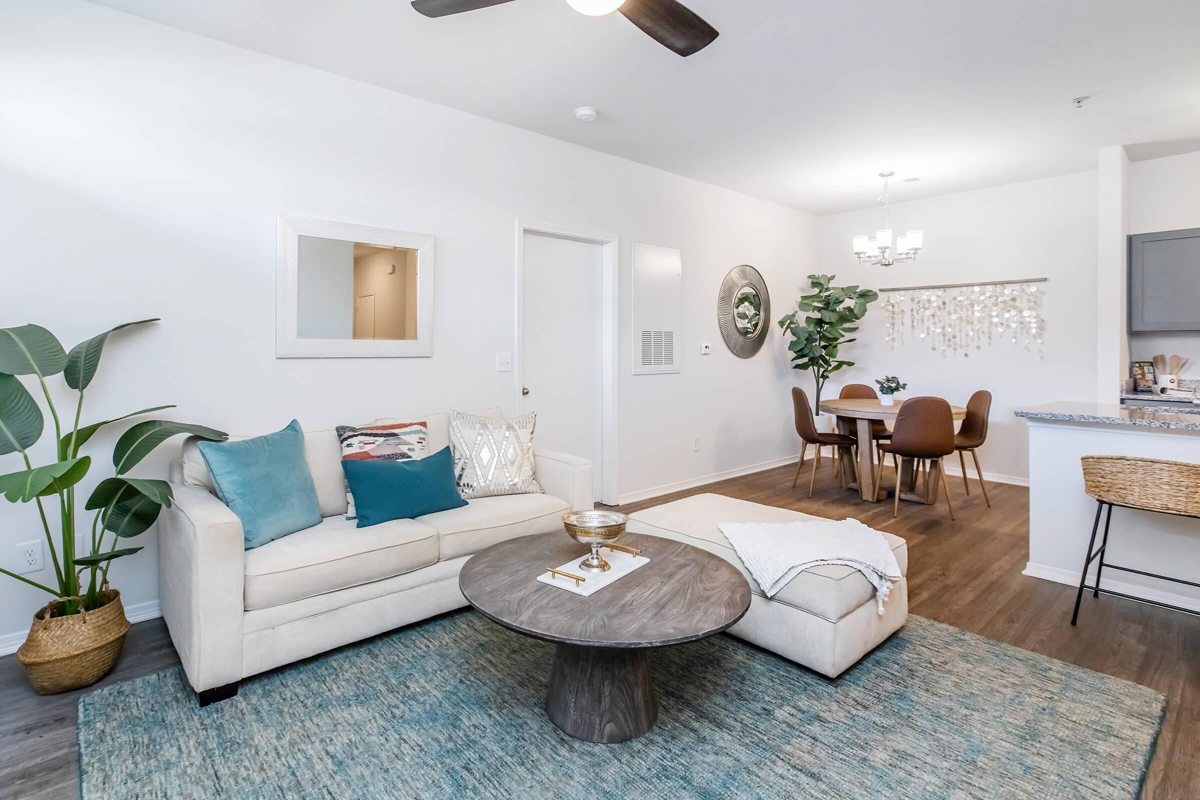 a living room filled with furniture and a fireplace