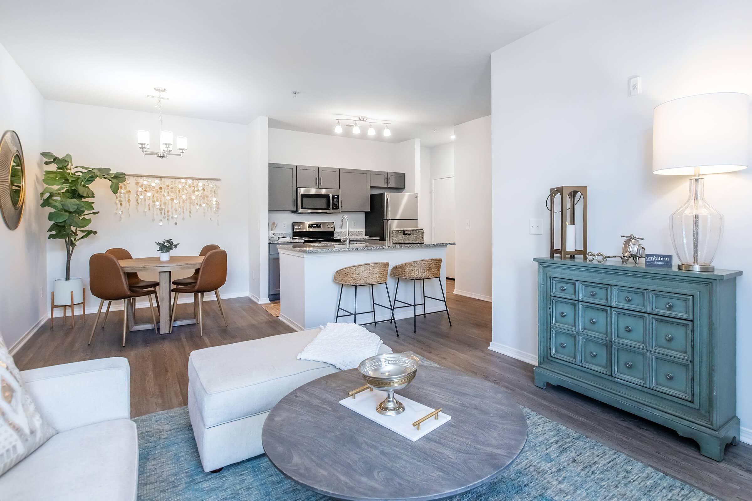 a living room filled with furniture and a table