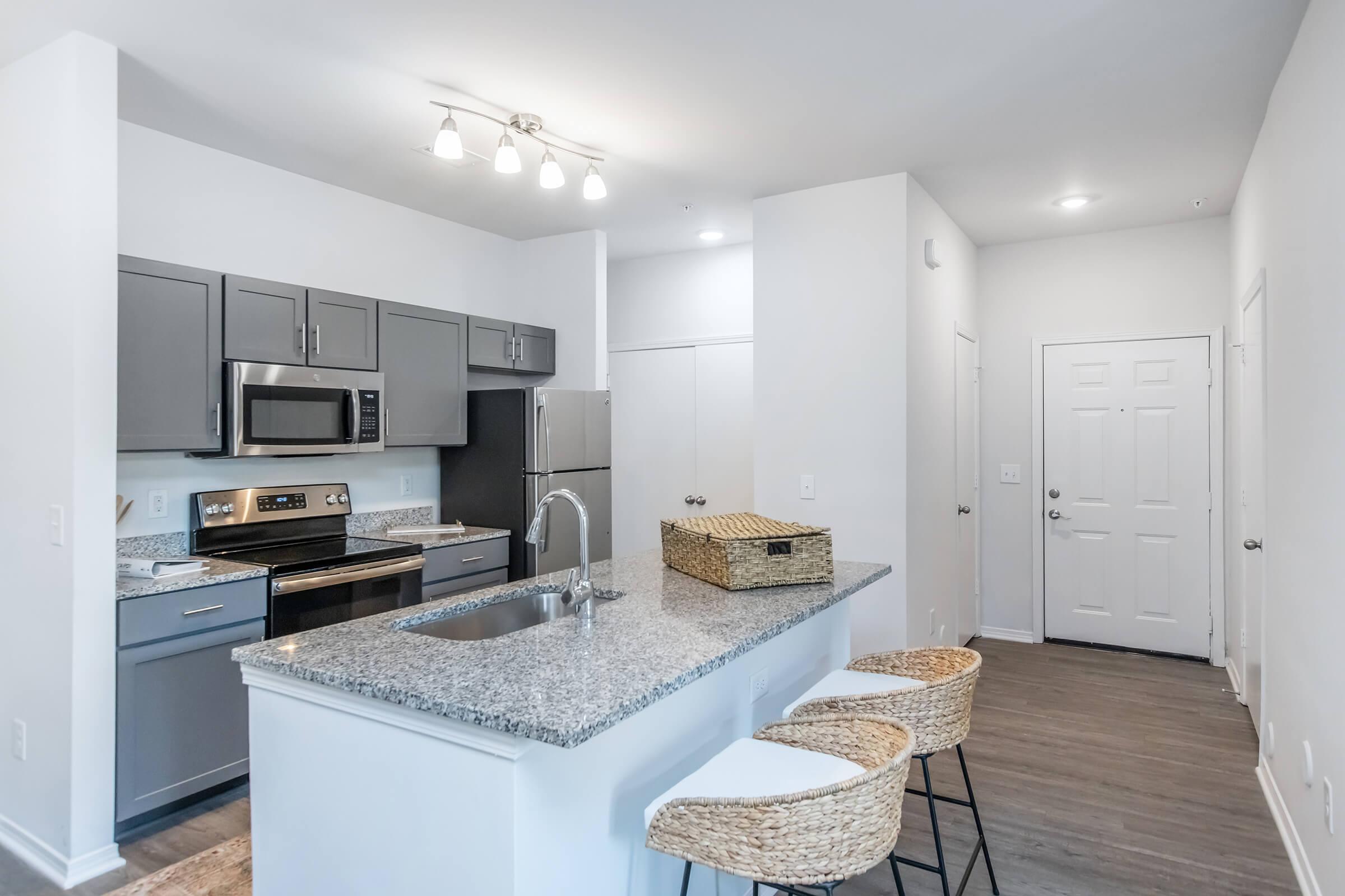 a kitchen with a sink and a refrigerator