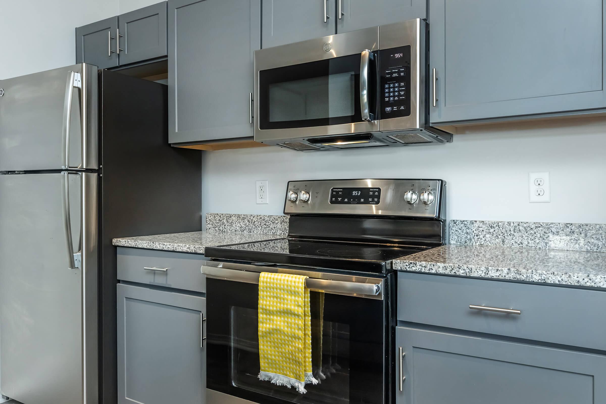 a kitchen with a stove top oven sitting inside of a refrigerator