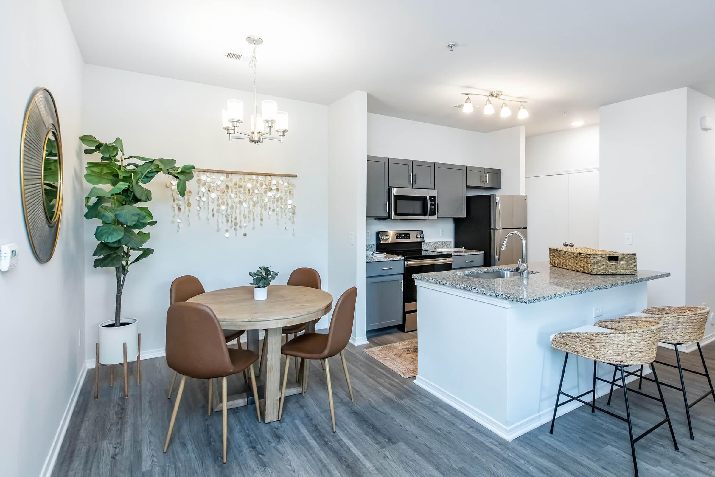 a kitchen with a dining room table