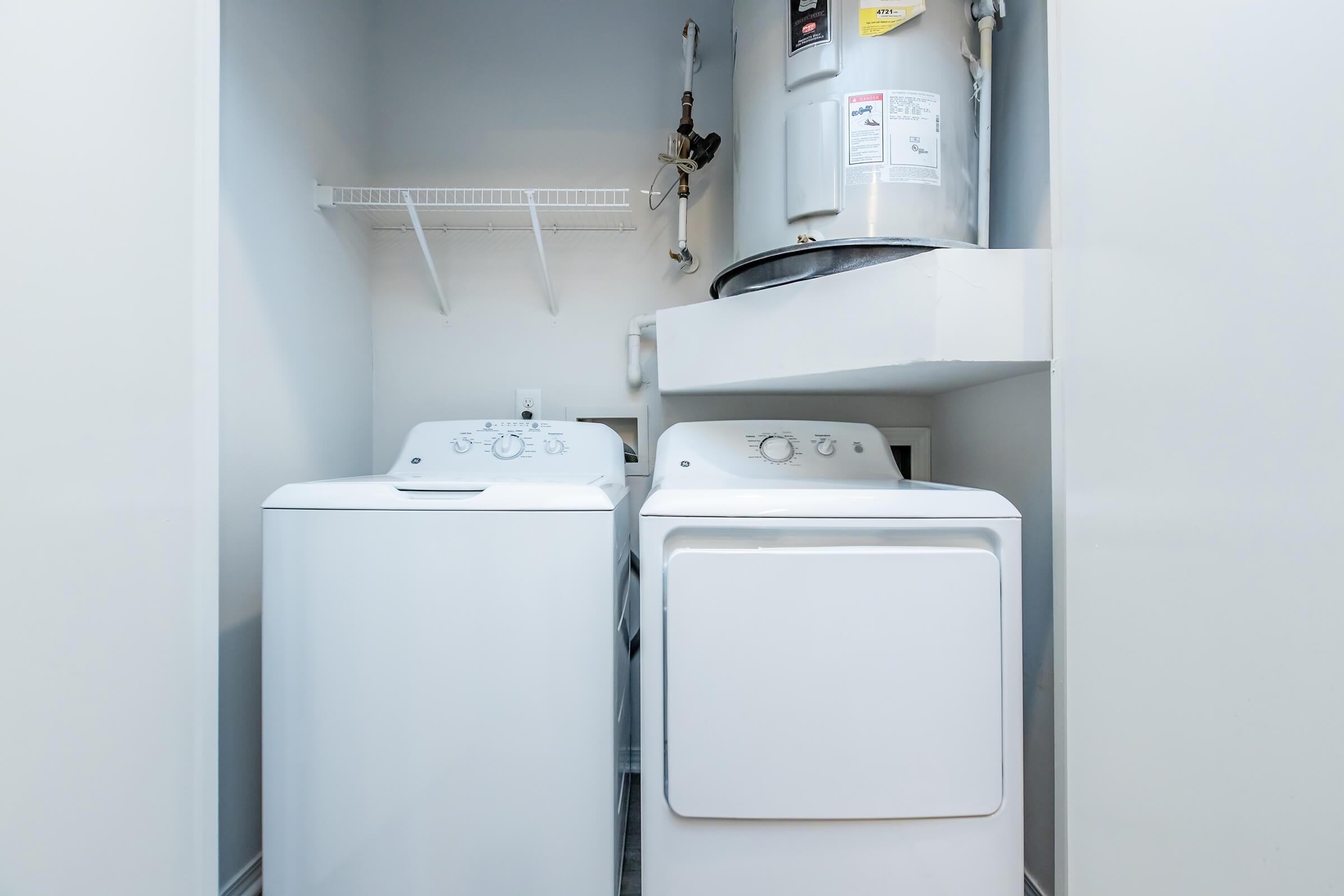 a microwave oven sitting on top of a refrigerator