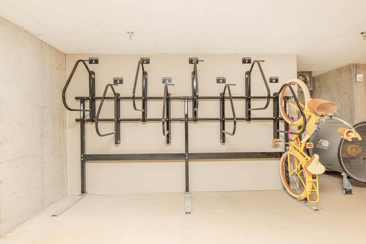 a bicycle leaning against a wall