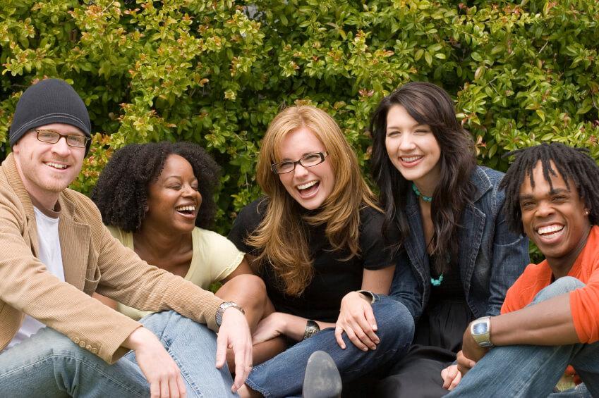 a group of people sitting on a bench
