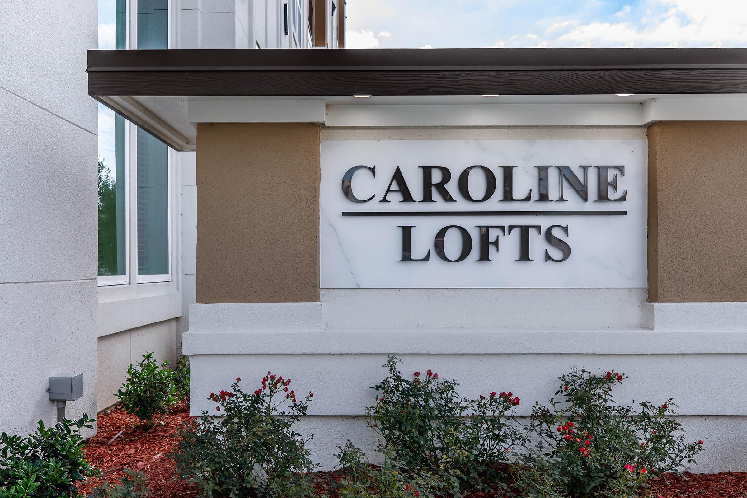 a sign in front of a house