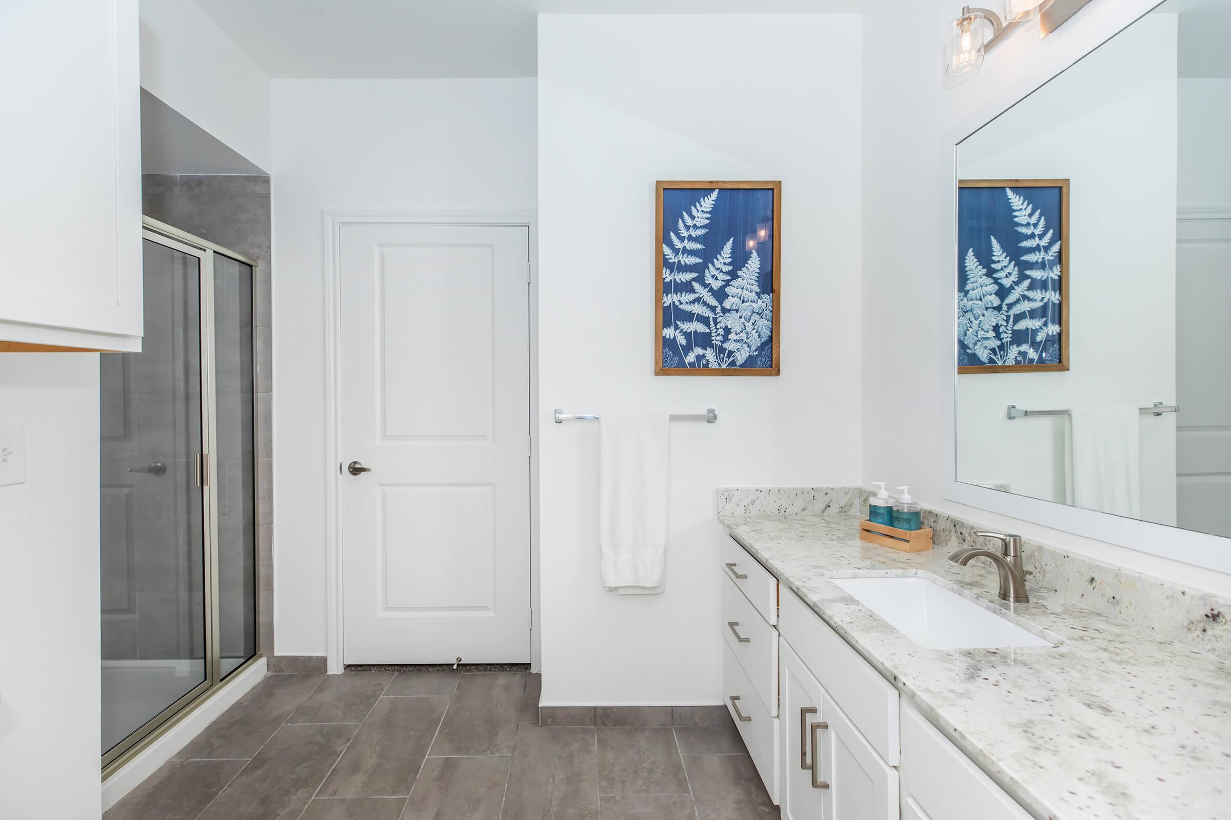 a kitchen with a sink and a mirror