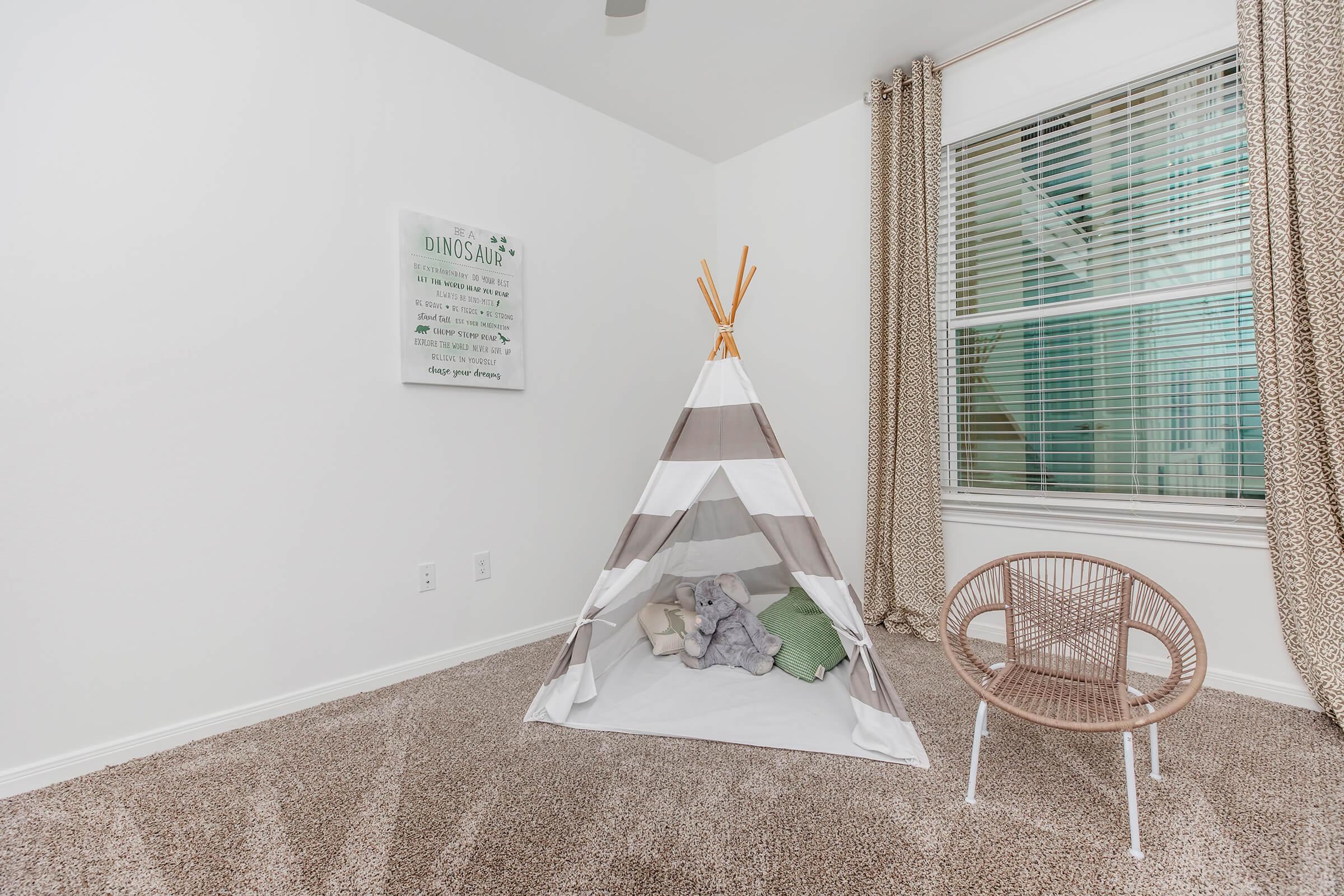 a close up of a bedroom next to a window