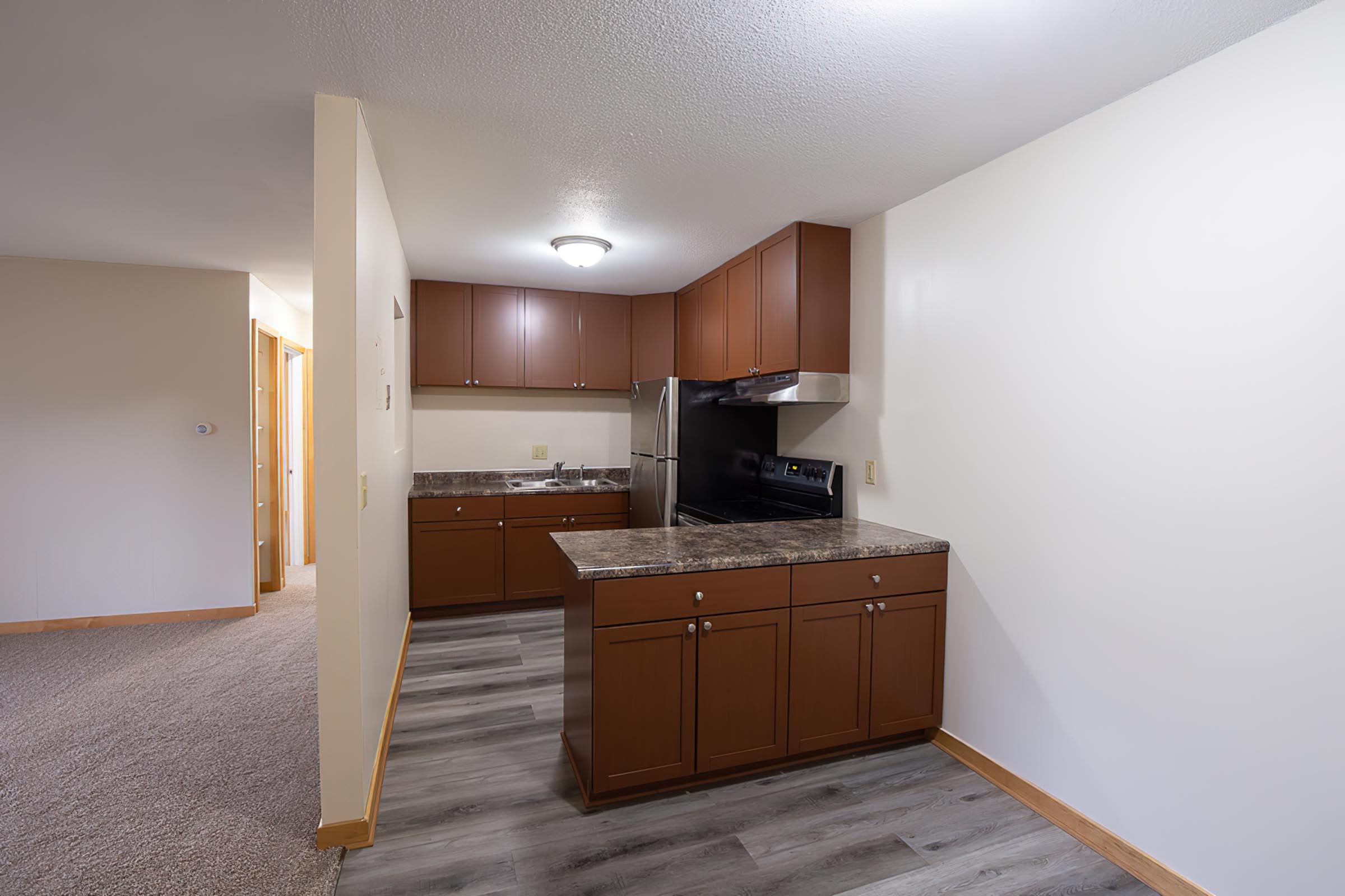 a kitchen with a wood floor