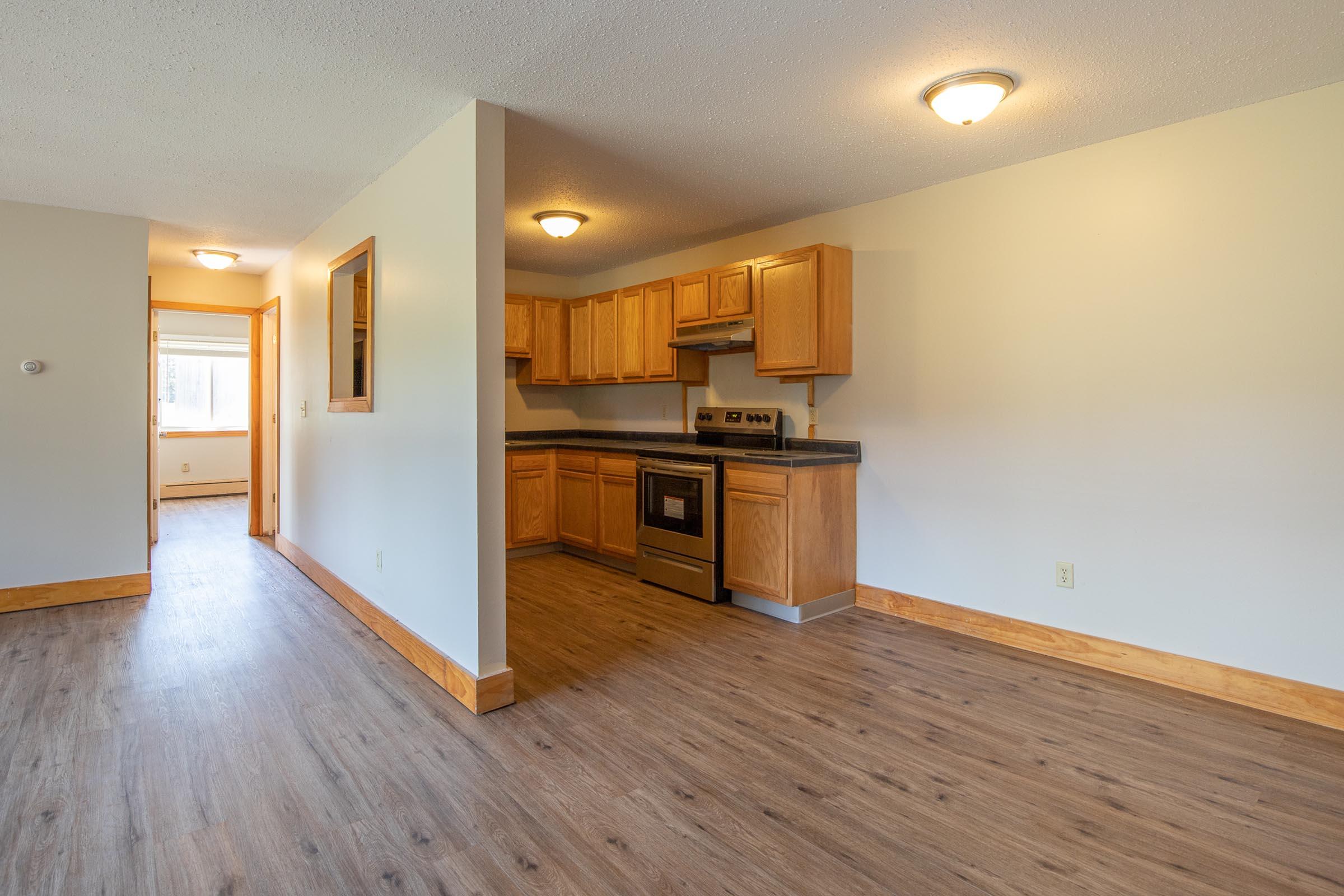 a kitchen with a wood floor