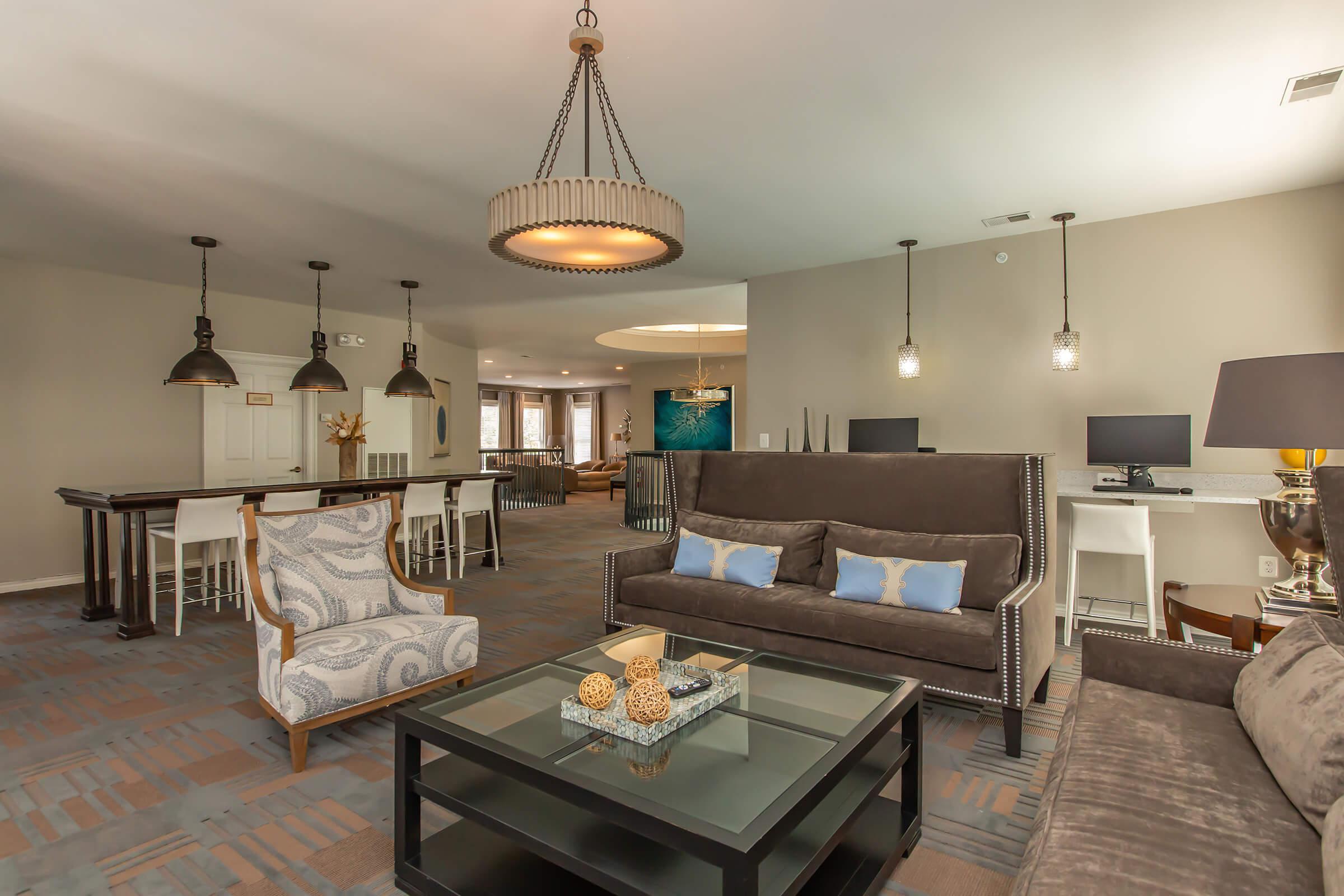 a living room filled with furniture and a table