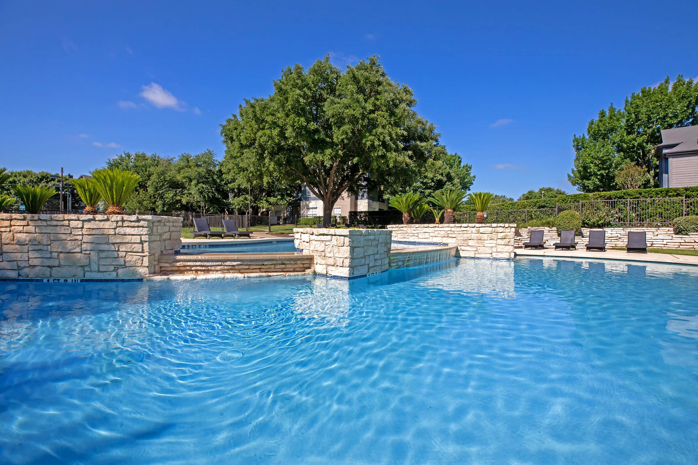 a pool next to a body of water