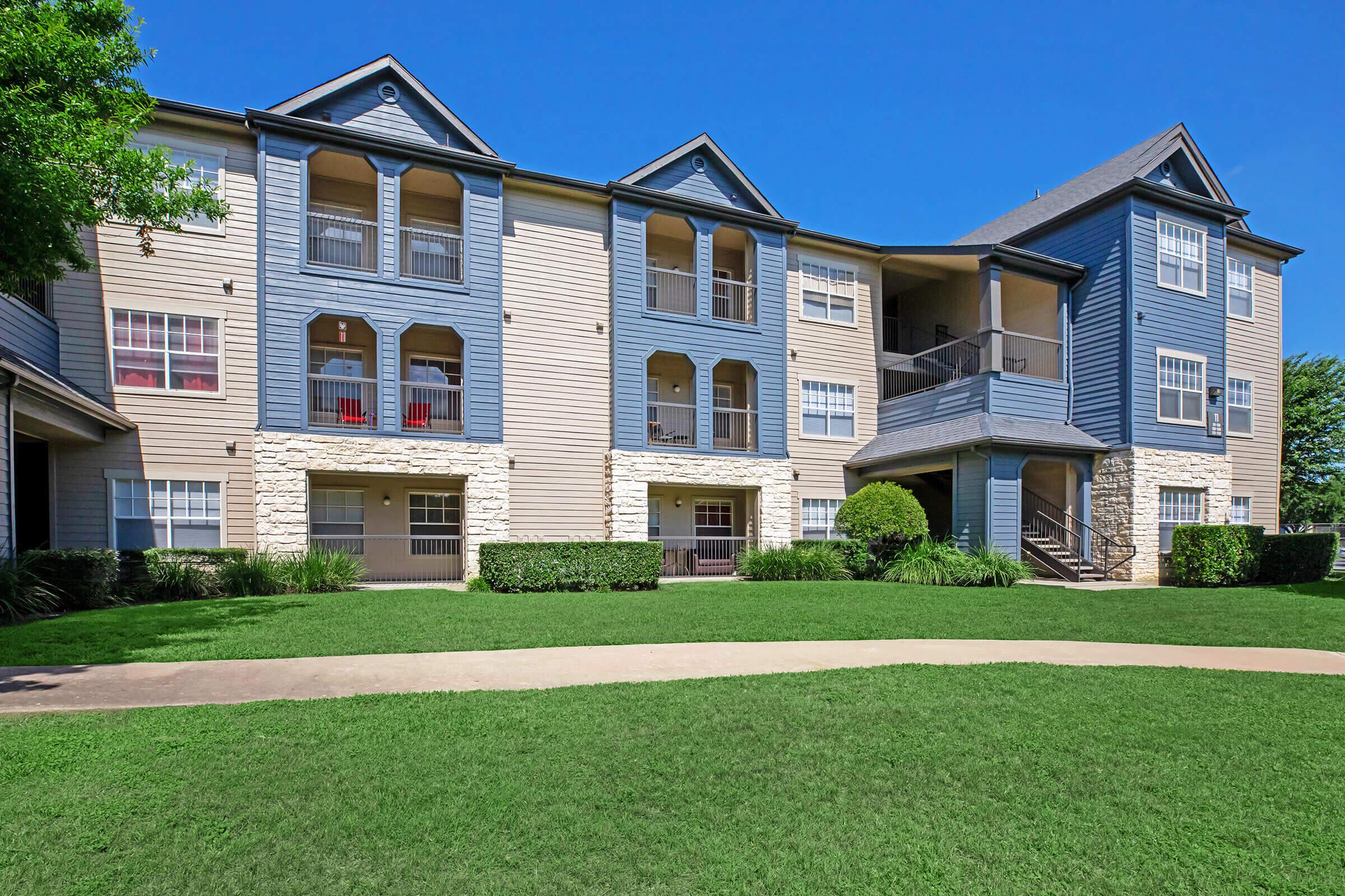 the community building with green shrubs