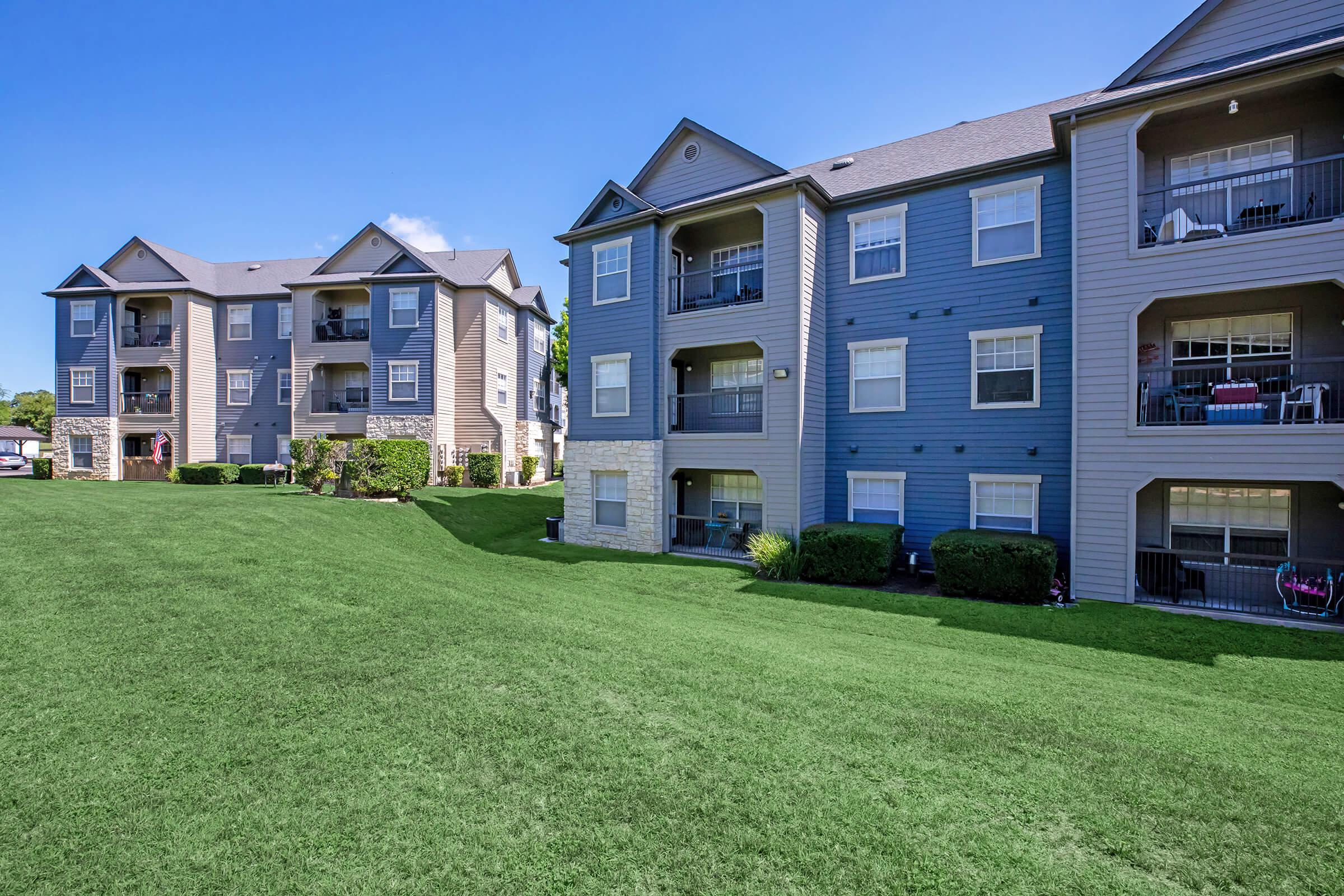 the community buildings with green grass