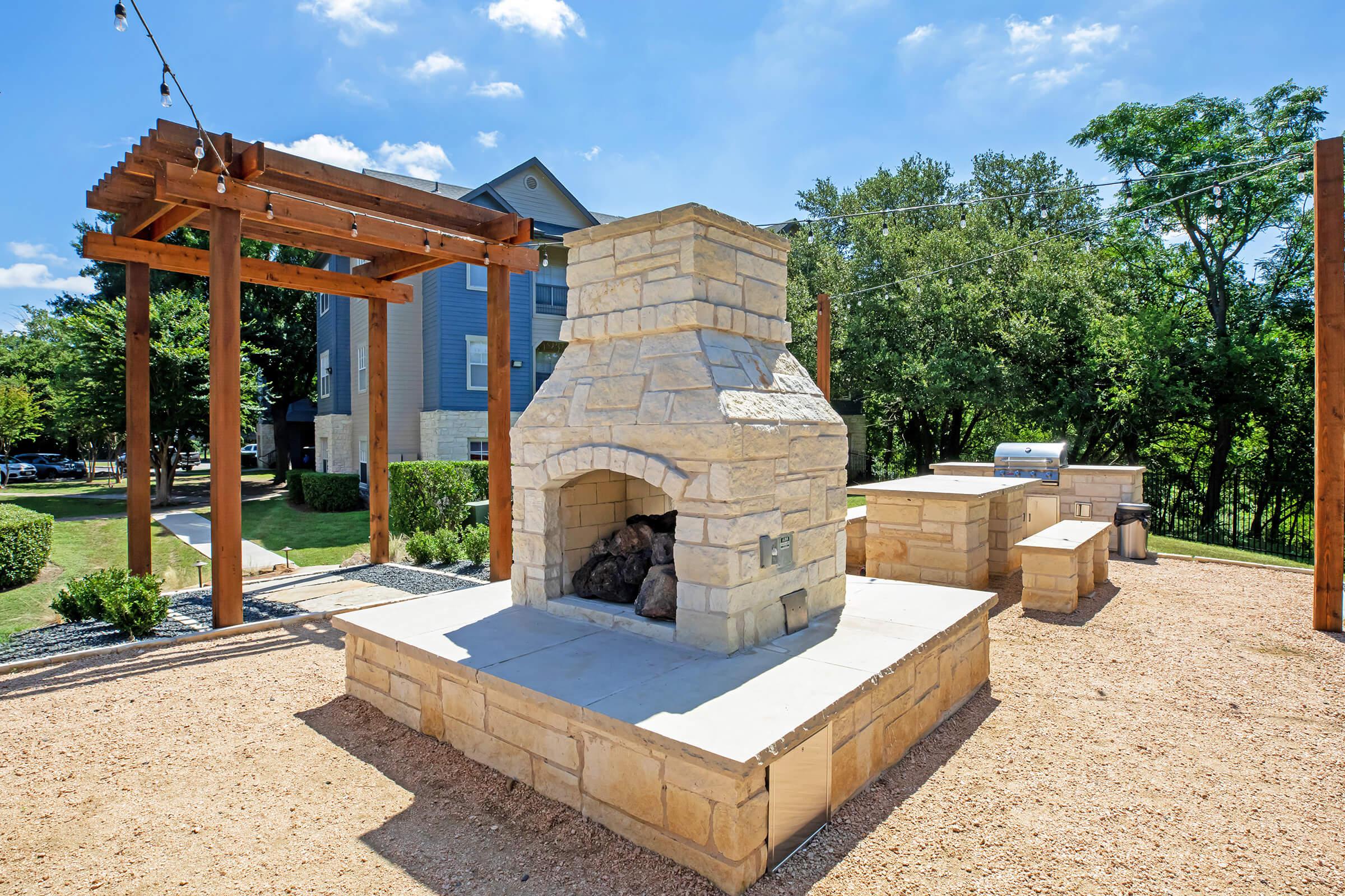 The Falls Round Rock Apartments outdoor fireplaces