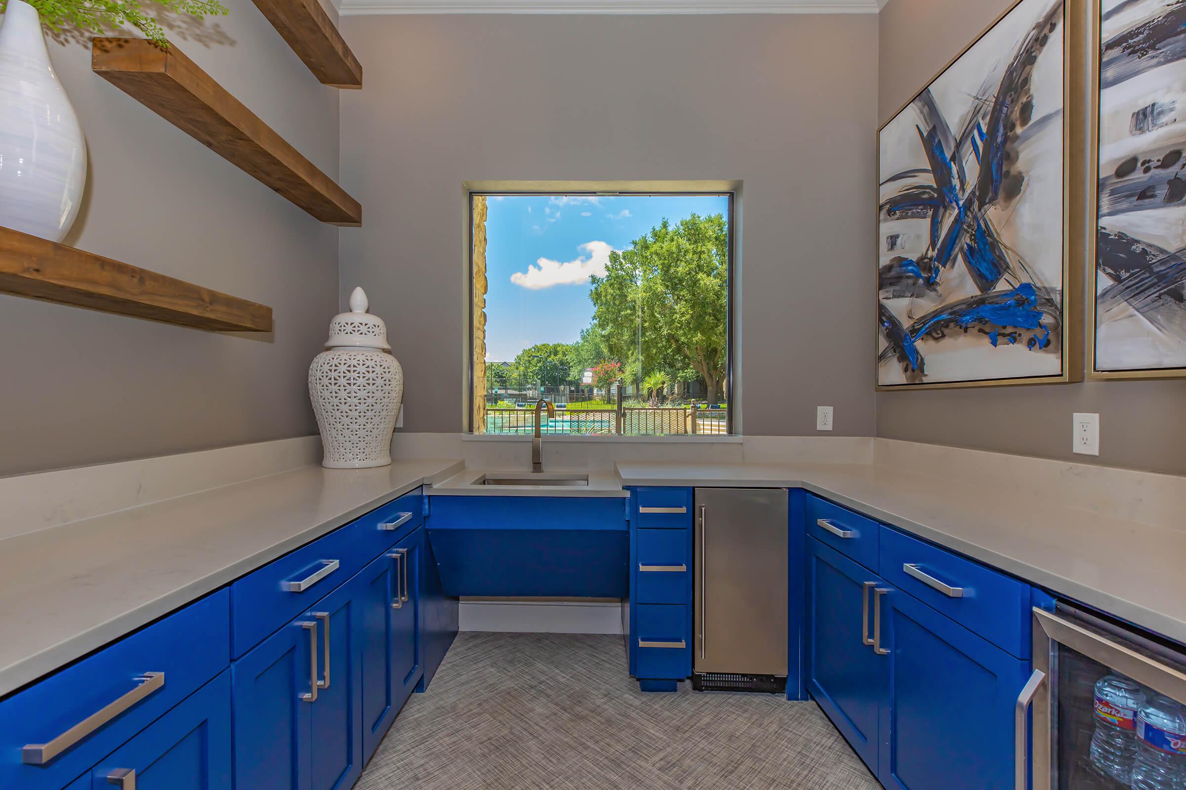 community kitchen with blue cabinets