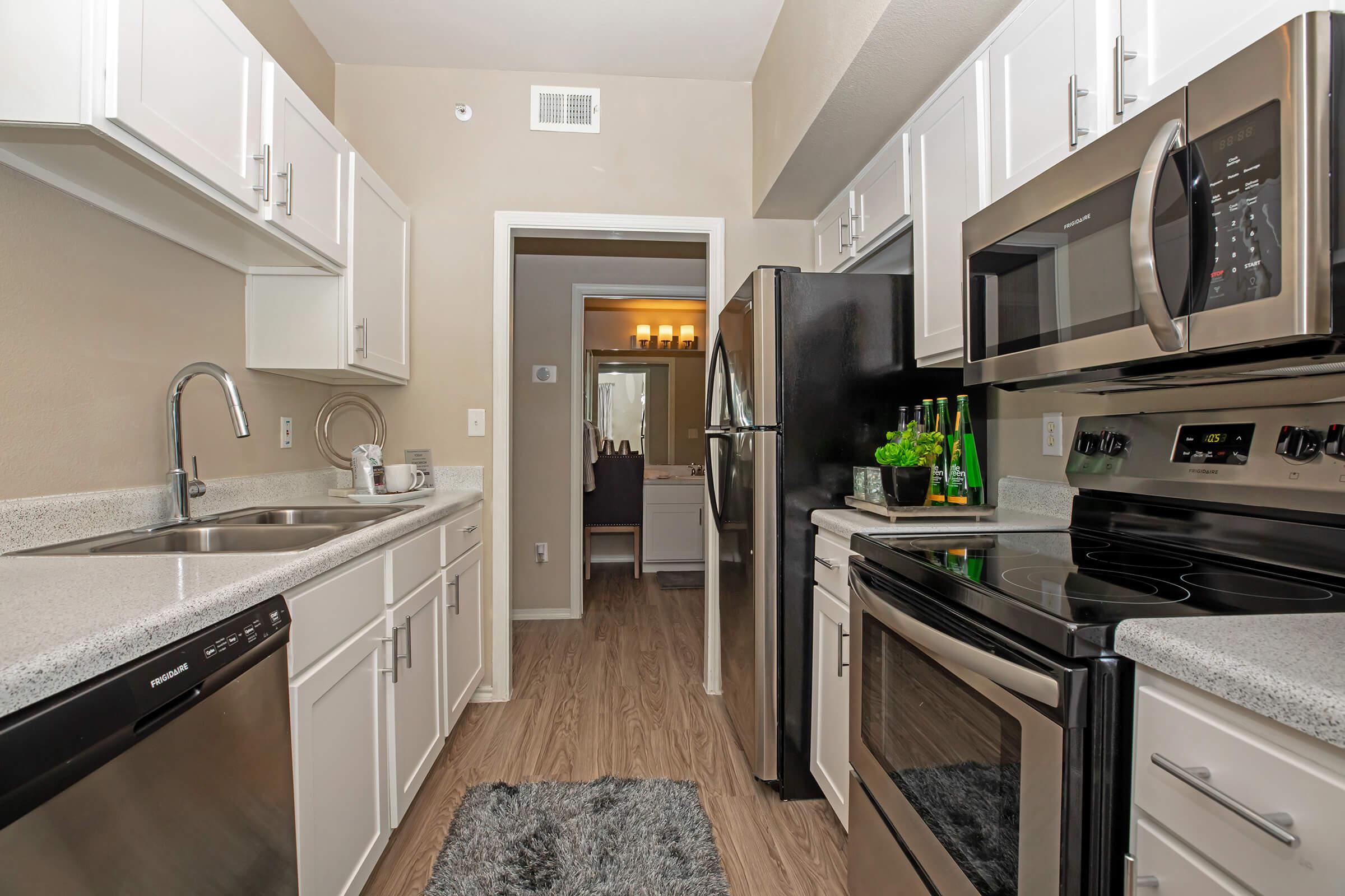 a kitchen with stainless steel appliances