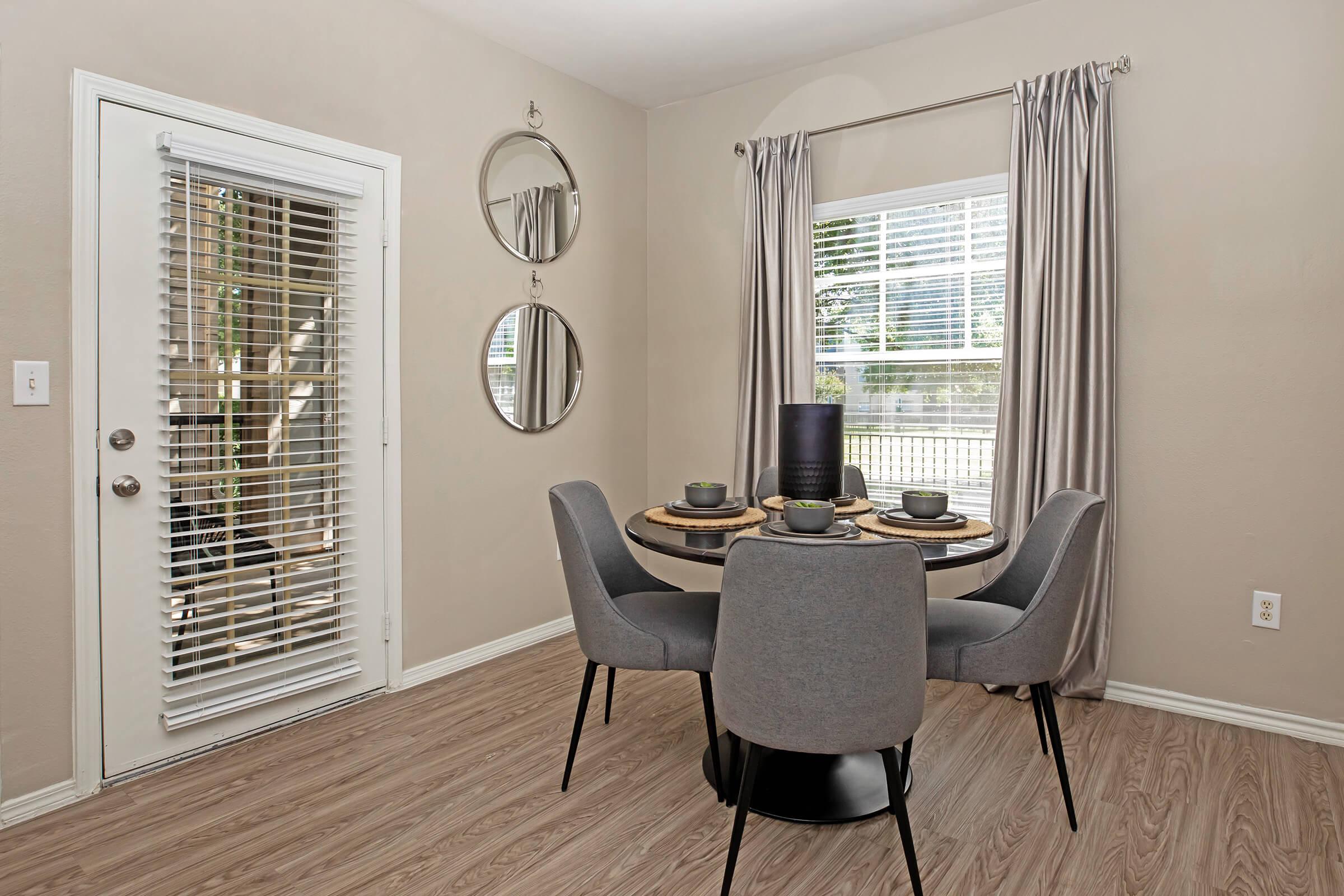 a dining room with the wooden floors