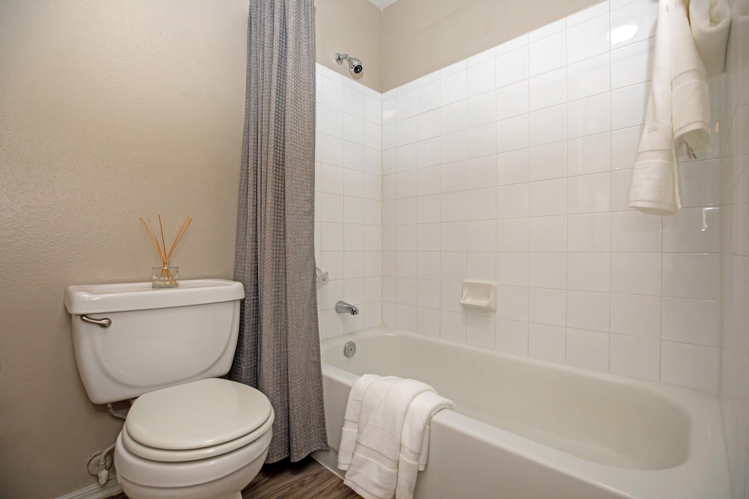 a furnished bathroom with white towels